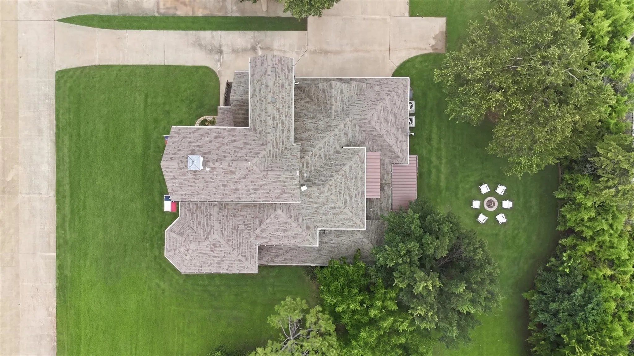 Over a third of an acre with an oversized 3 car garage with an 8'x12' storage room attached, built in speakers and an electric car charger that conveys.