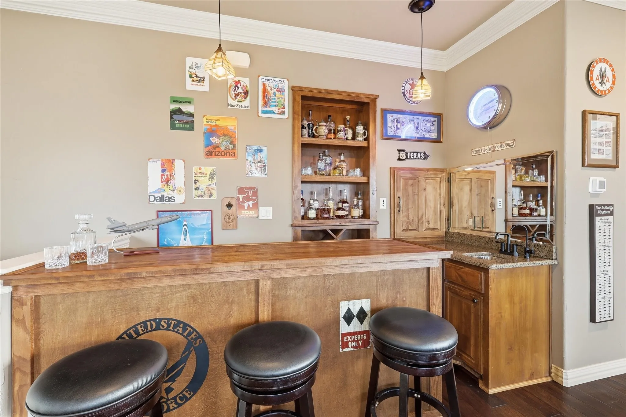 The bar has ample storage, a Uline beverage refrigerator, a built in wine rack, a wet sink with granite and an installed reverse osmosis water purification system, a KitchenAid ice maker and the 3rd floor dumbwaiter access point.