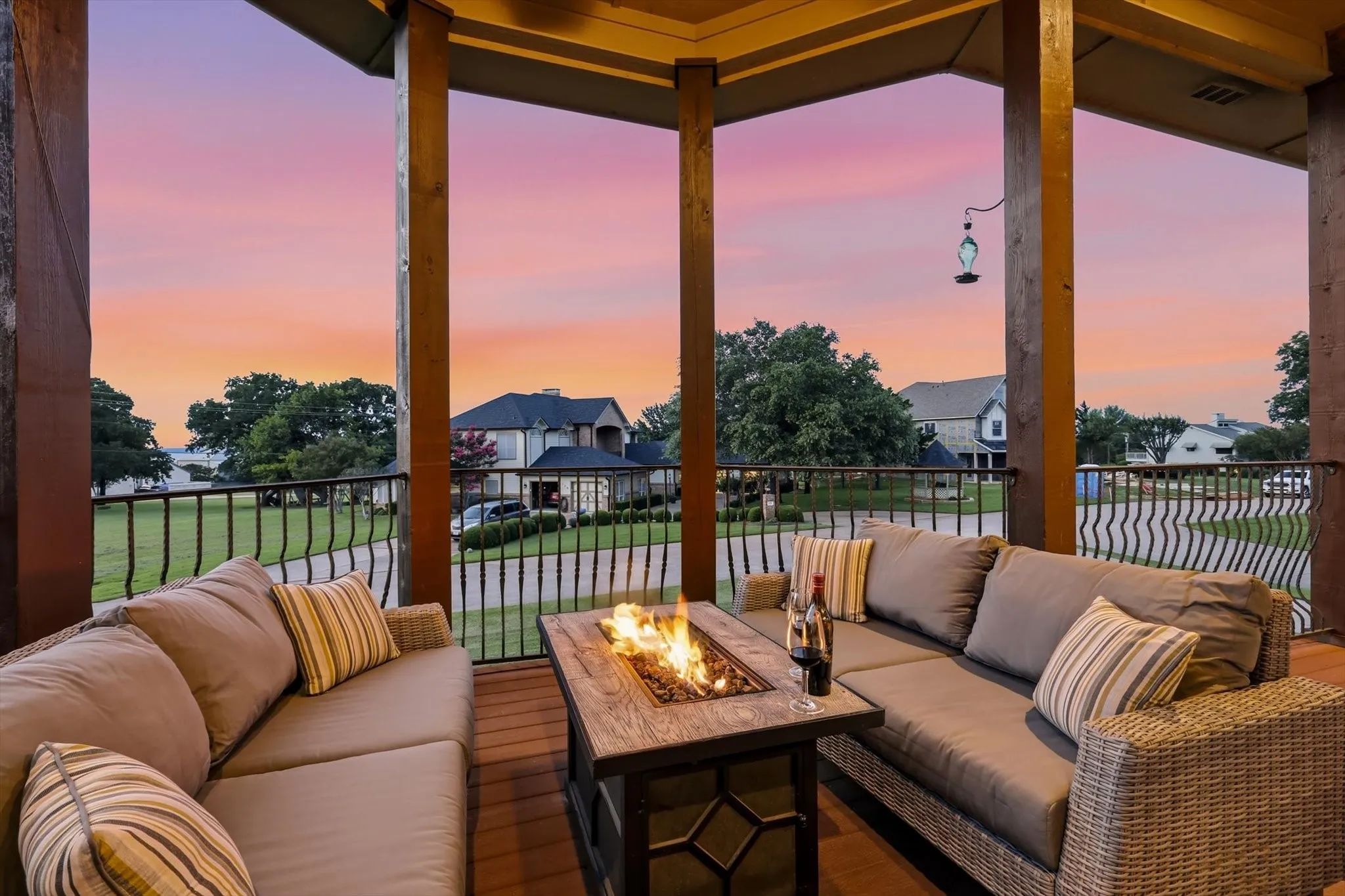 The 2nd story balcony is just off the main living area. It is huge with over 50' of Trex decking, a lake view, a ceiling fan and remote controlled sun shades.