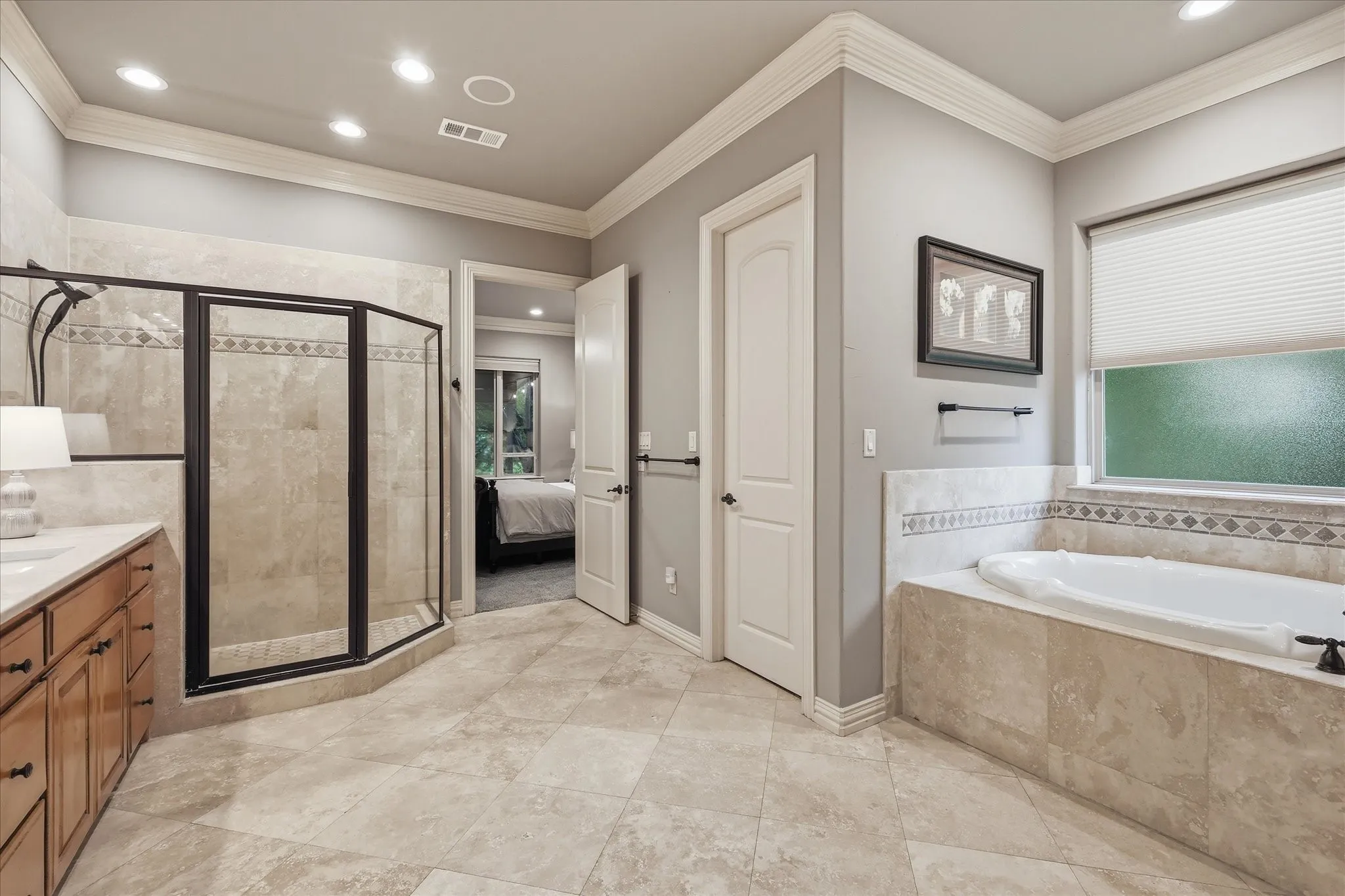 Other features in the ensuite are 2 huge walk in closets, a jetted soaking tub, electric shades and very large shower.