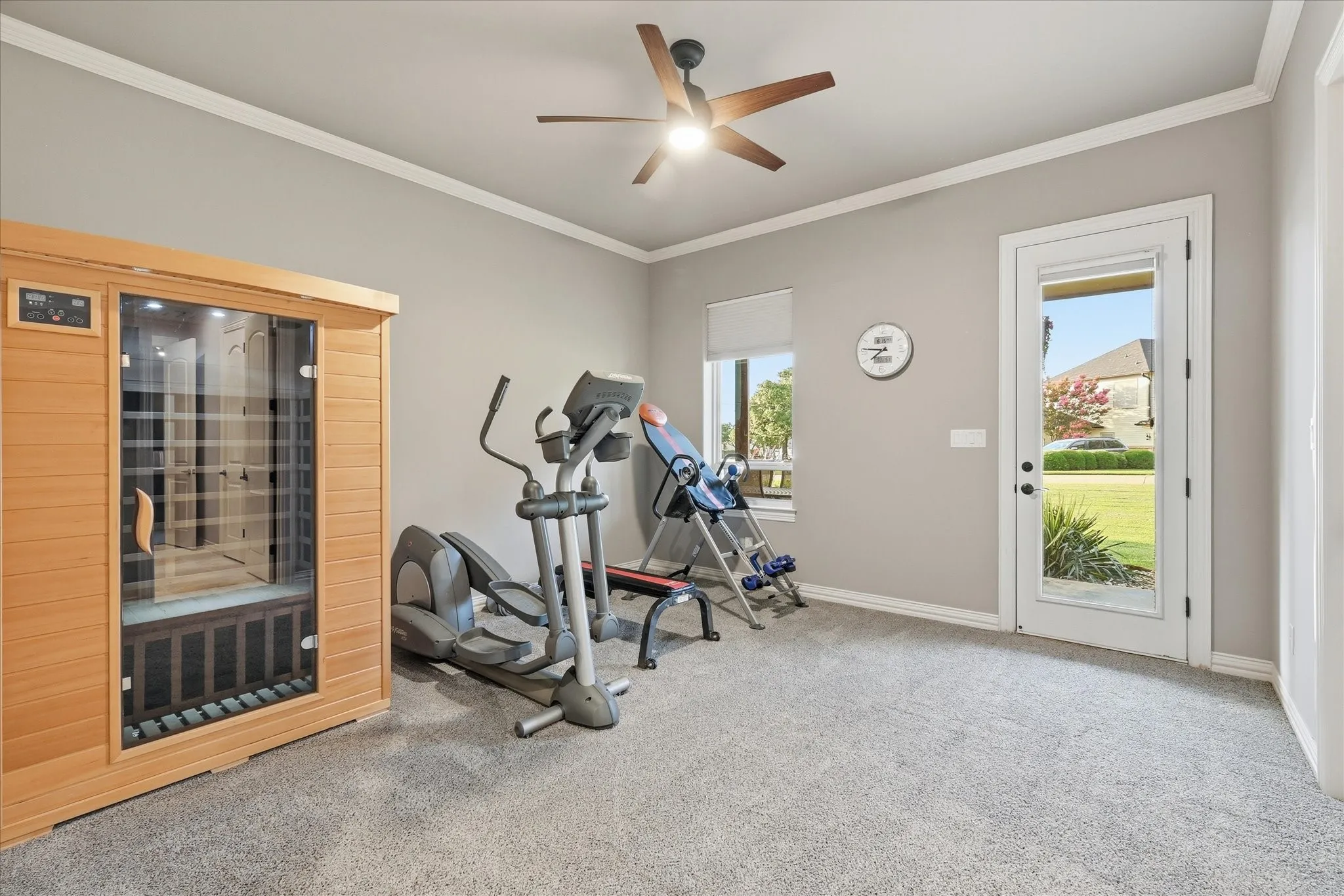 This bedroom is currently being used as an exercise room. It has a door leading to the front 1st floor covered porch, large walk in closet, double crown, new ceiling fan and utilizes the Jack and Jill bathroom.