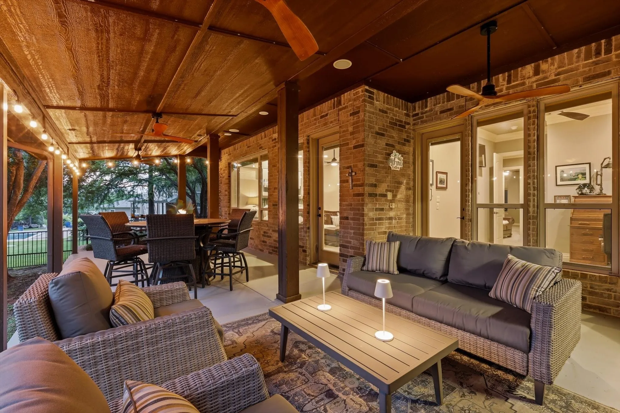 The 1st floor back patio is 32'x17'. It has 4 ceiling fans, ceiling outlets for plug in lighting, plumbed for a gas grill and built in sound system speakers.