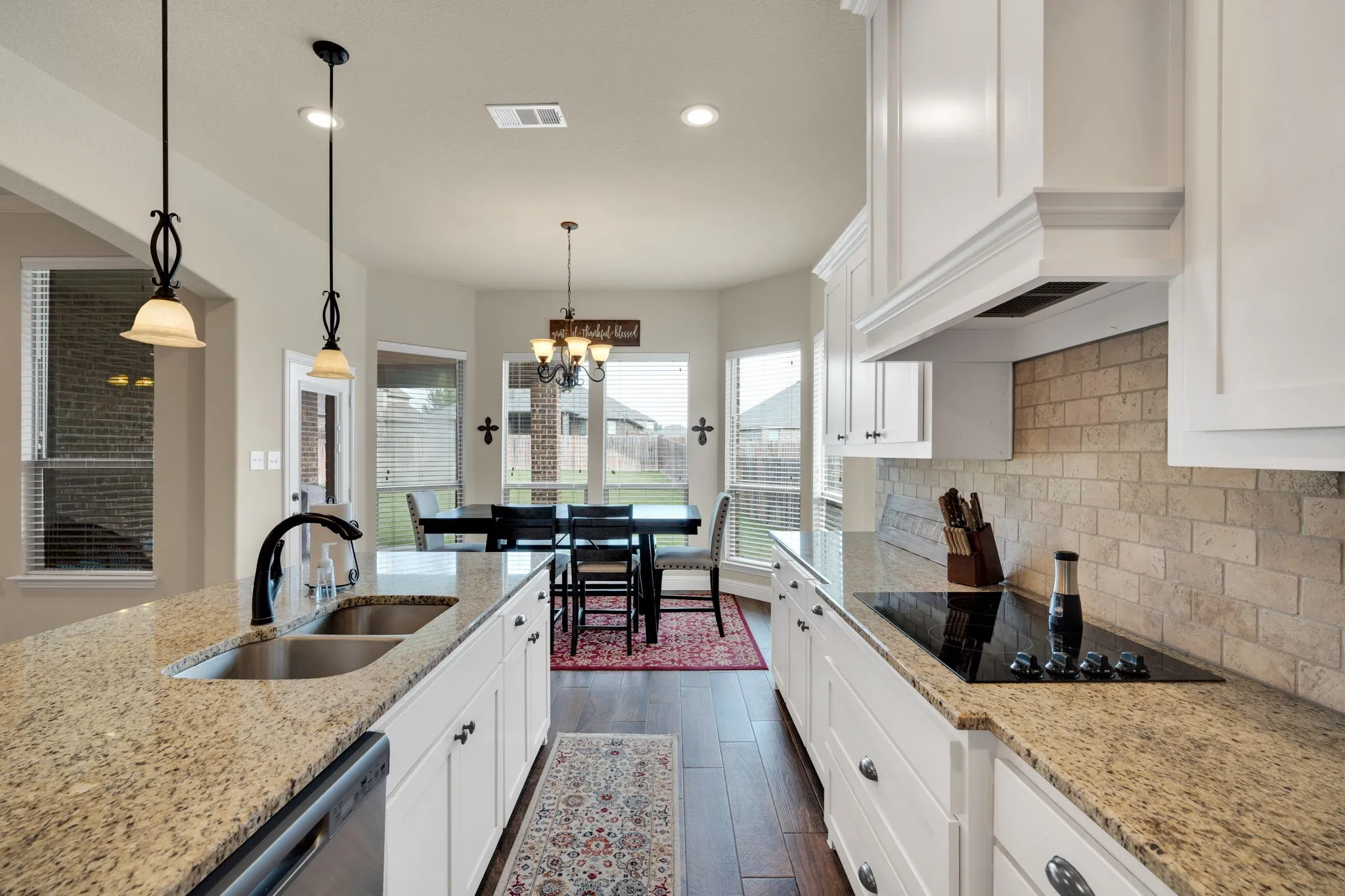 There is a seat for everyone. Whether it be casual dining at the kitchen island or sitting down more formal at your dining room table, this kitchen makes it all possible.