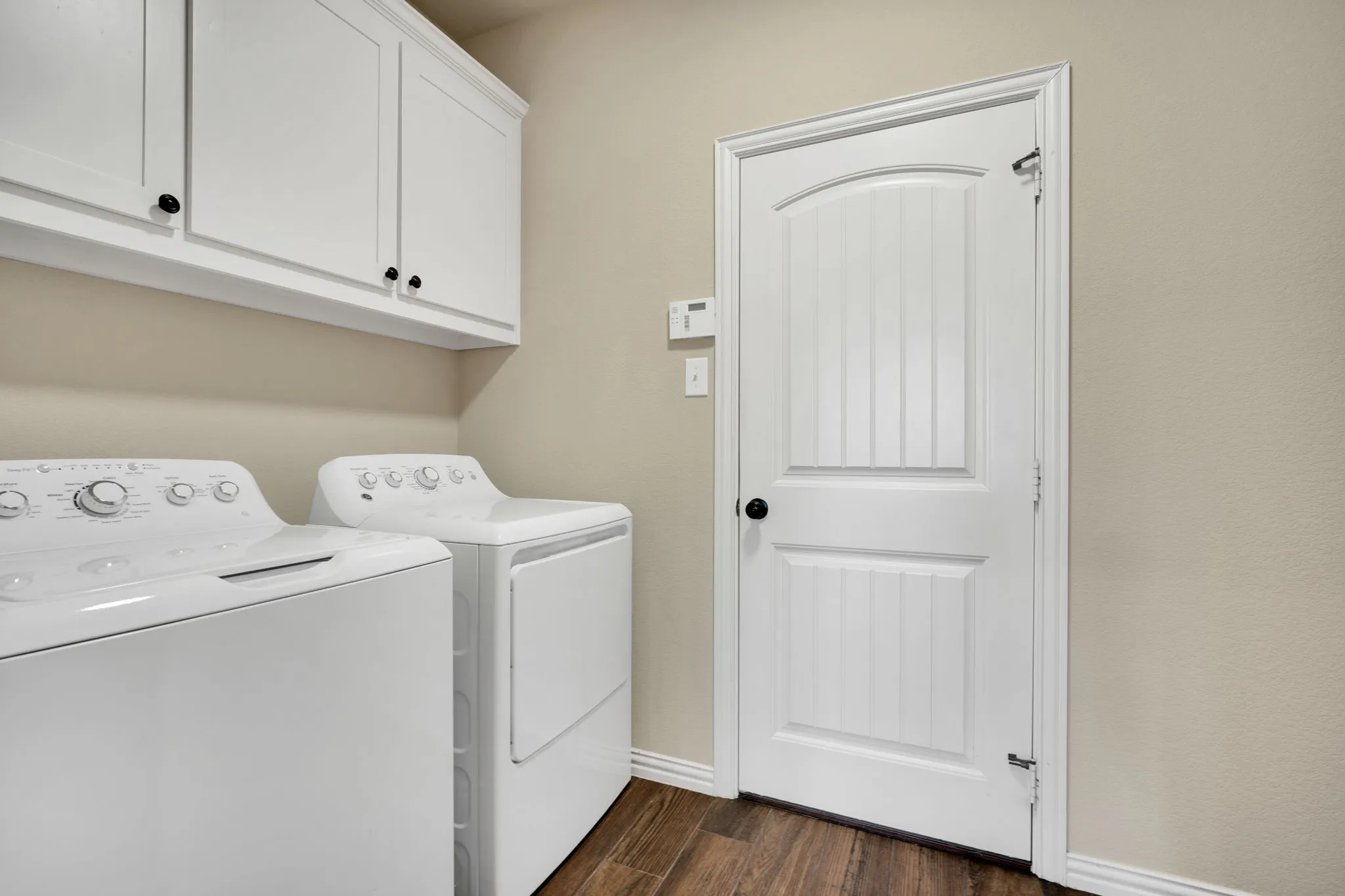 First floor utility room. Access it from the kitchen or from the garage.