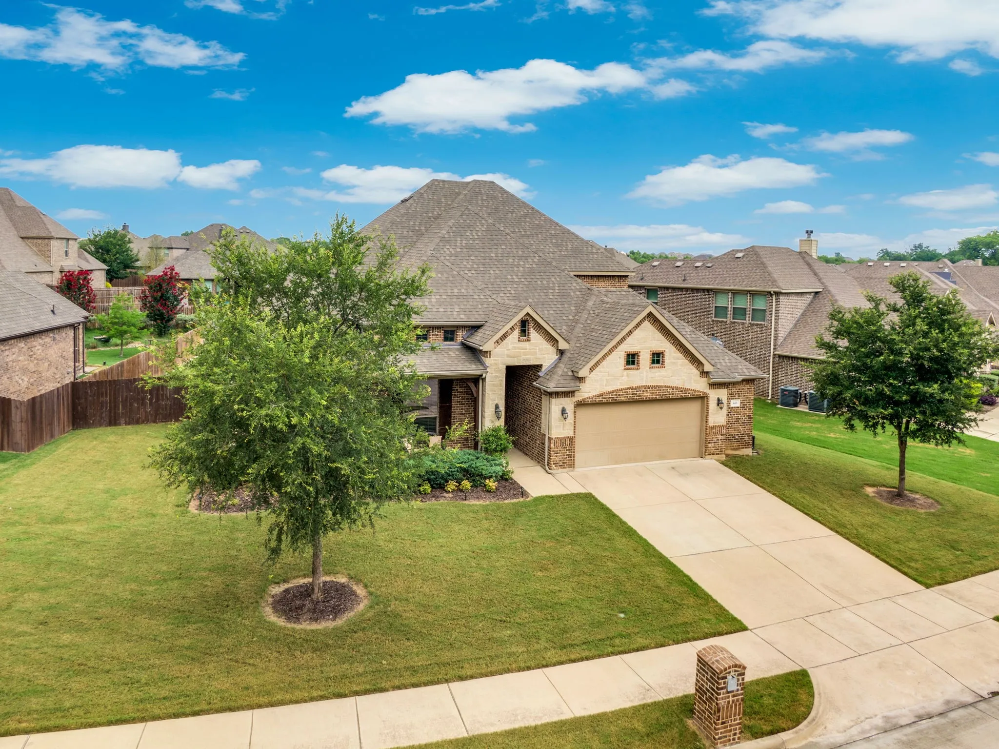 Seller is known for mowing the front and back yards two times a week some weeks. Look at those cut lines! An irrigation system helps keep the yards nice and green all summer long.