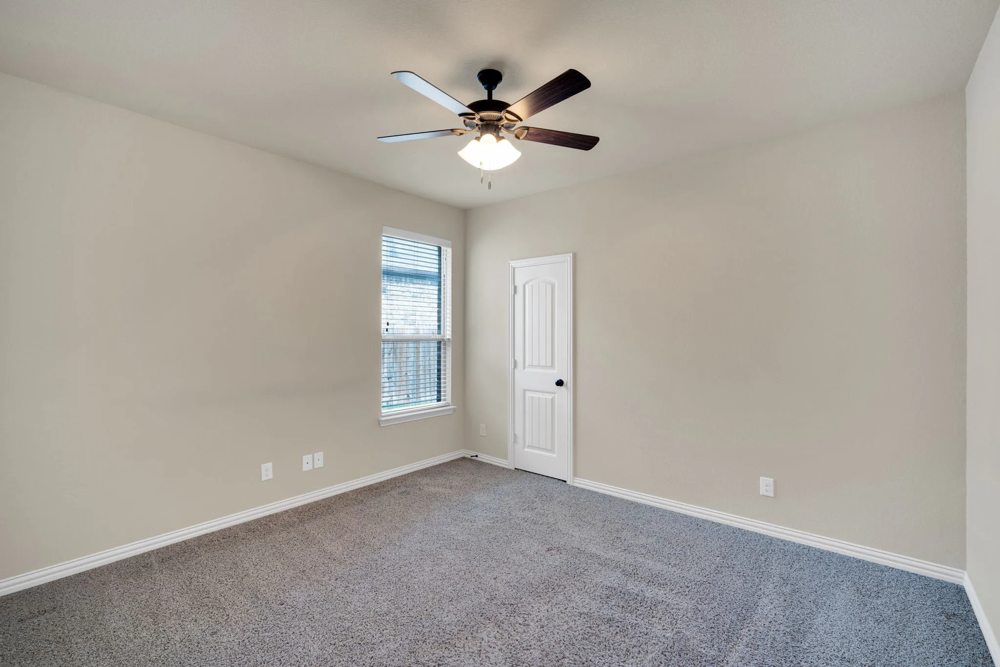One of two first floor secondary bedrooms with a decent size closet.
