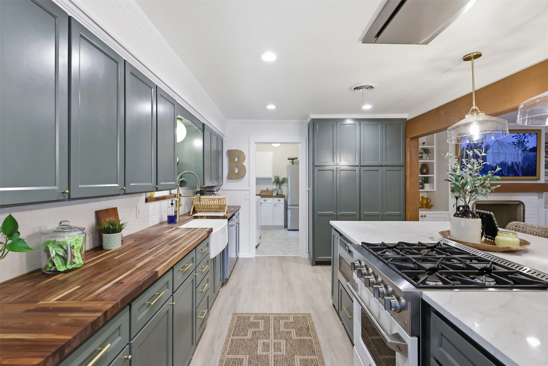 Lots of cabinets and custom built pantry cabinets to store food items.