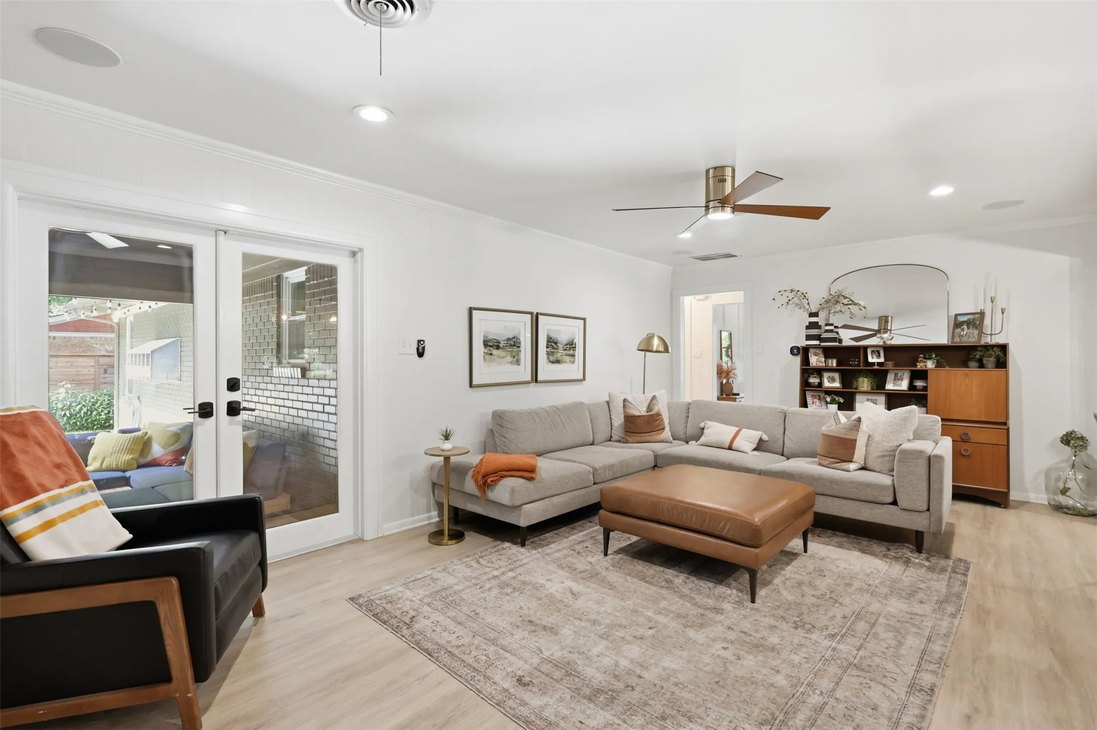 Double doors lead to large covered patio outside.