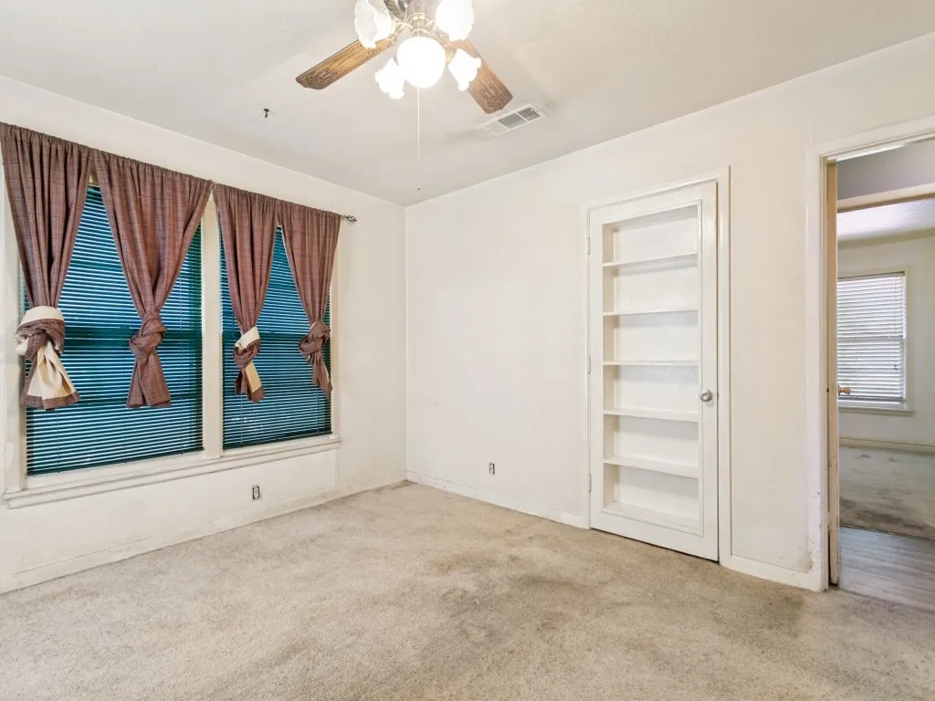 This unique closet door has shelving built into it.