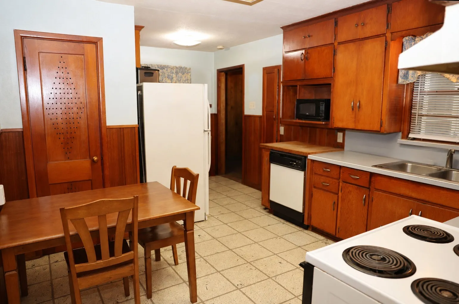 The eat-in kitchen has two different areas that can accommodate a dinette table.