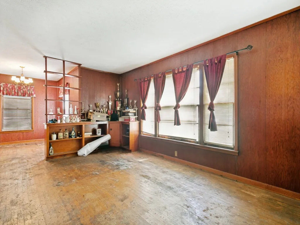 Built-in shelving separates the formal living room from the dining room, creating two separate spaces with an open feel.