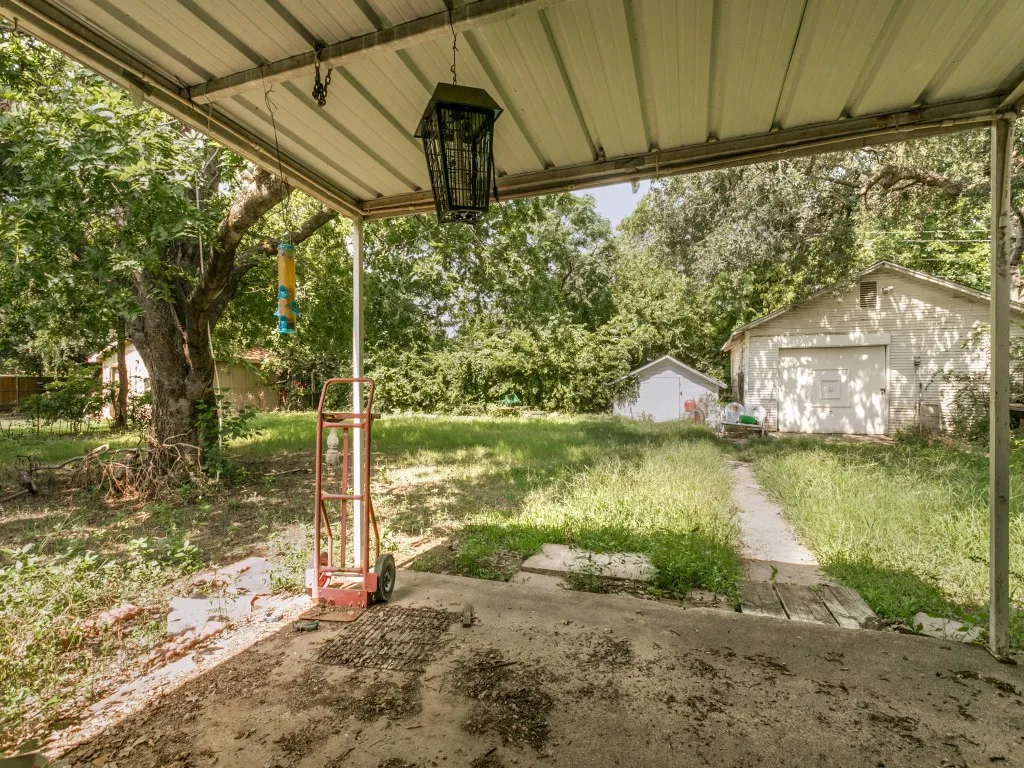 The back patio is covered and overs a great view of the backyard.