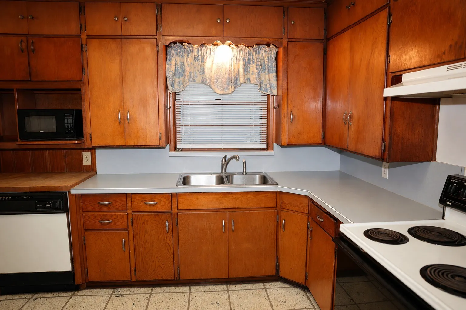 The kitchen window allows in natural light to brighten this space.  Another unique feature in this kitchen is the built-in cutting board above the drawer to the left of the​​‌​​​​‌​​‌‌​‌‌​​​‌‌​‌​‌​‌​​​‌​​ oven.