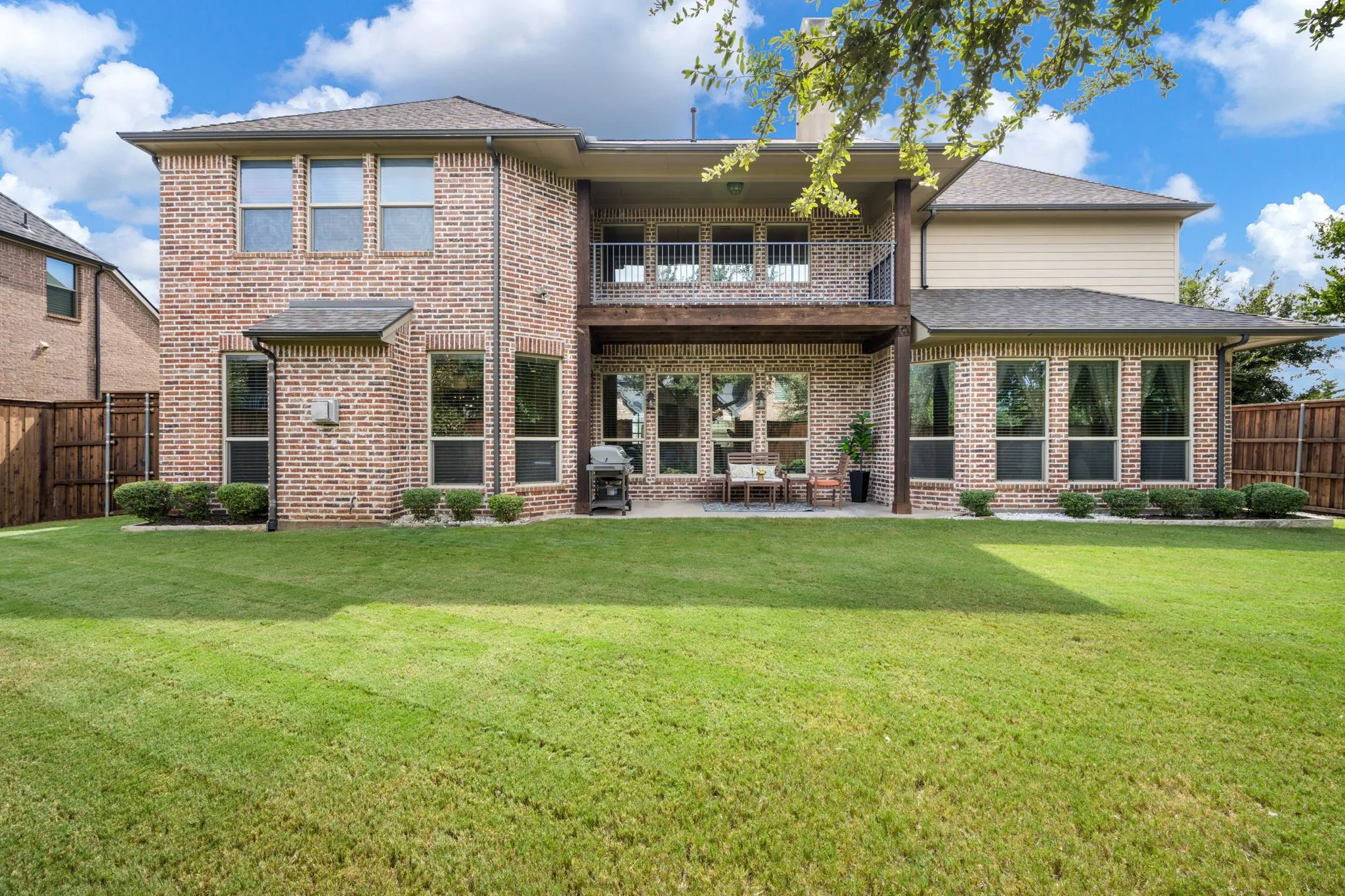 Brick exterior with a second-story balcony