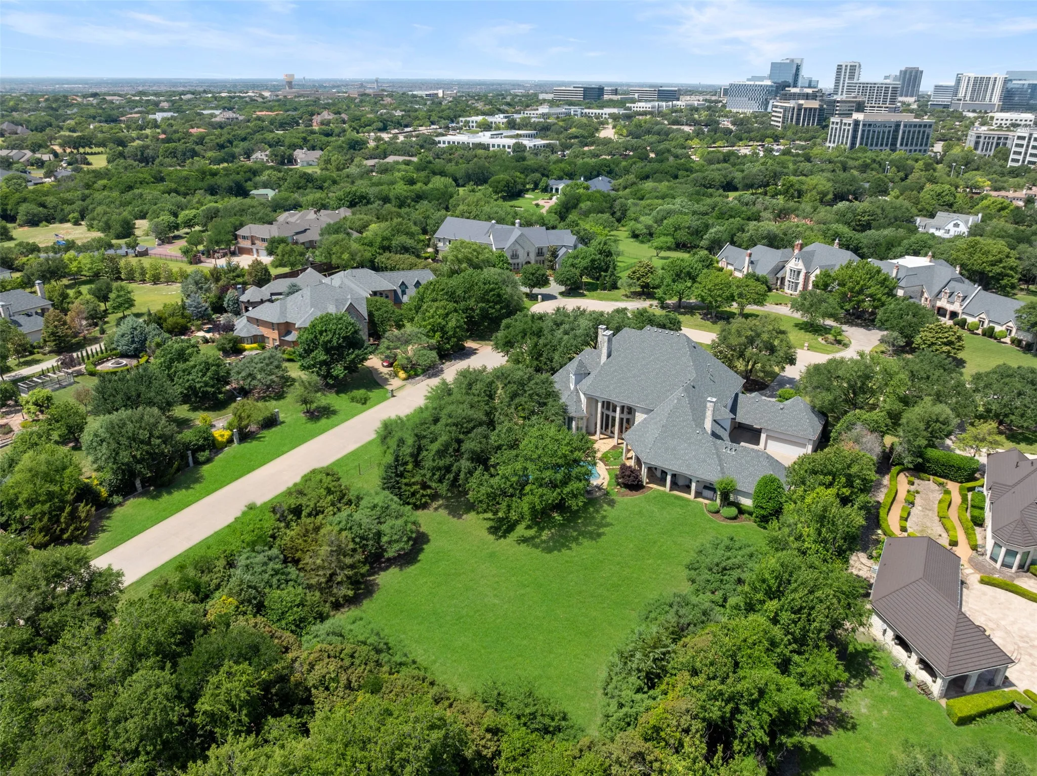 Aerial of expansove back yard with a view of Frisco's Star in the background.