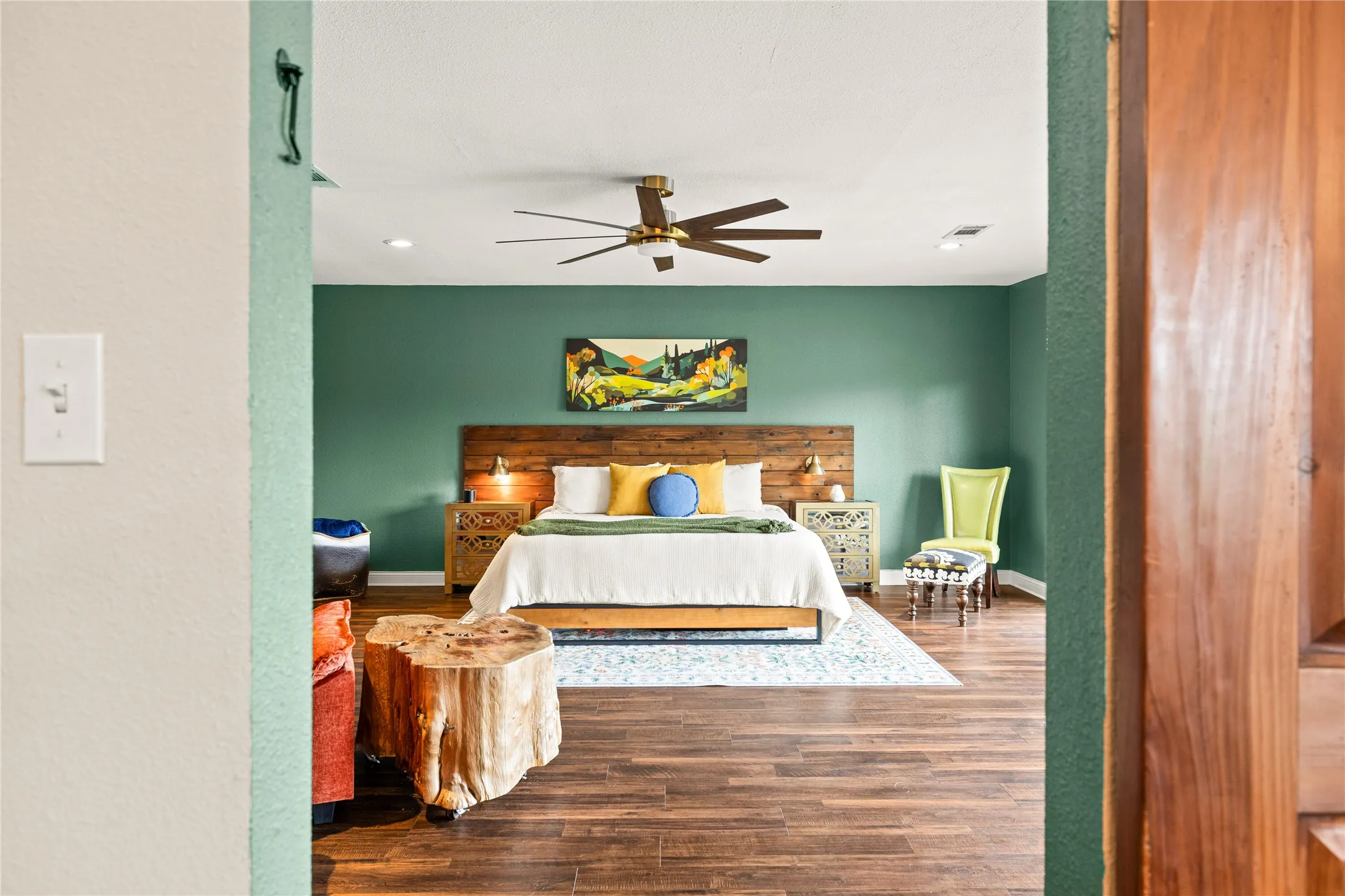Spacious interior featuring dark wood-finish flooring, recessed lighting, and a modern ceiling fan