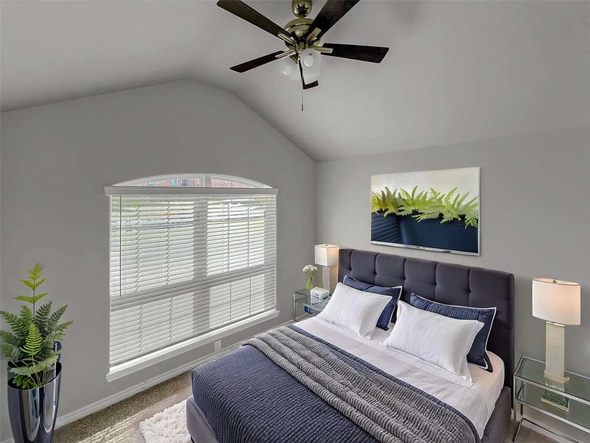 Virtually staged
Vaulted ceiling featuring a ceiling fan with integrated lighting