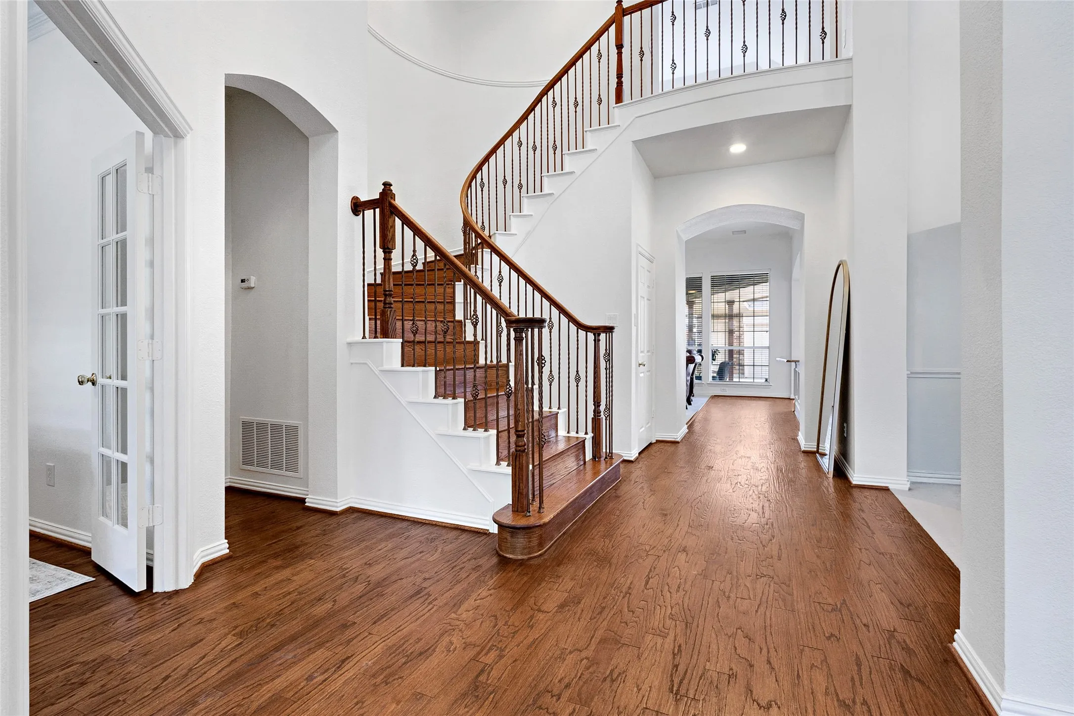 A BEAUTIFUL 2 STORY GRAND ENTRY with fresh paint and new lighting