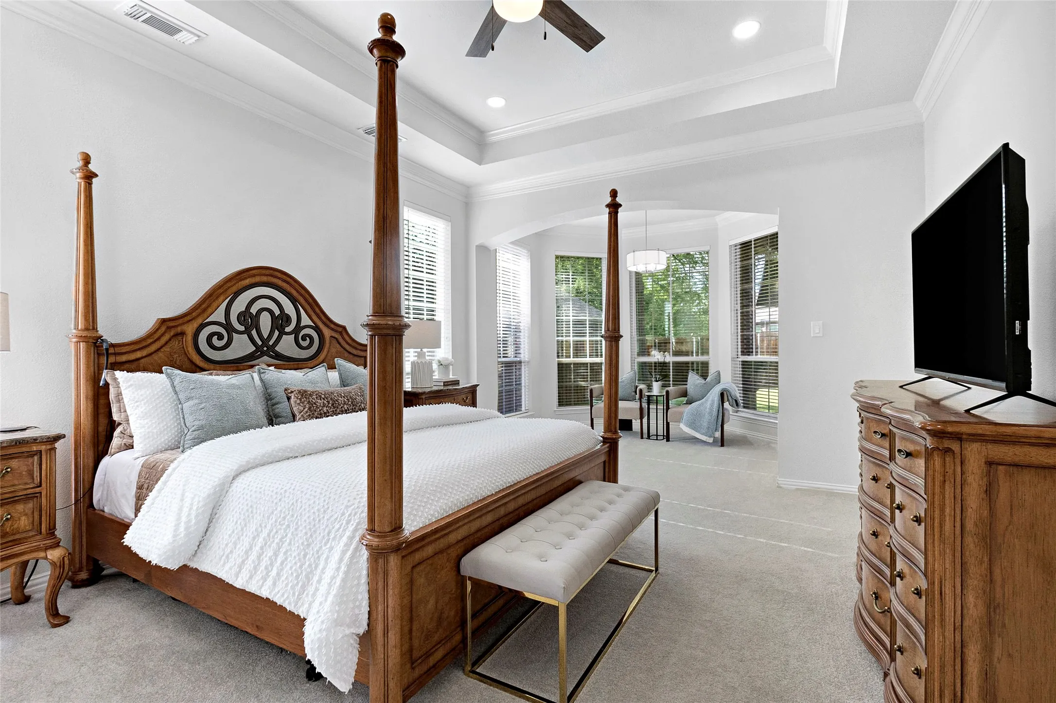 A large beautiful primary retreat with 7 large windows and private sitting area.