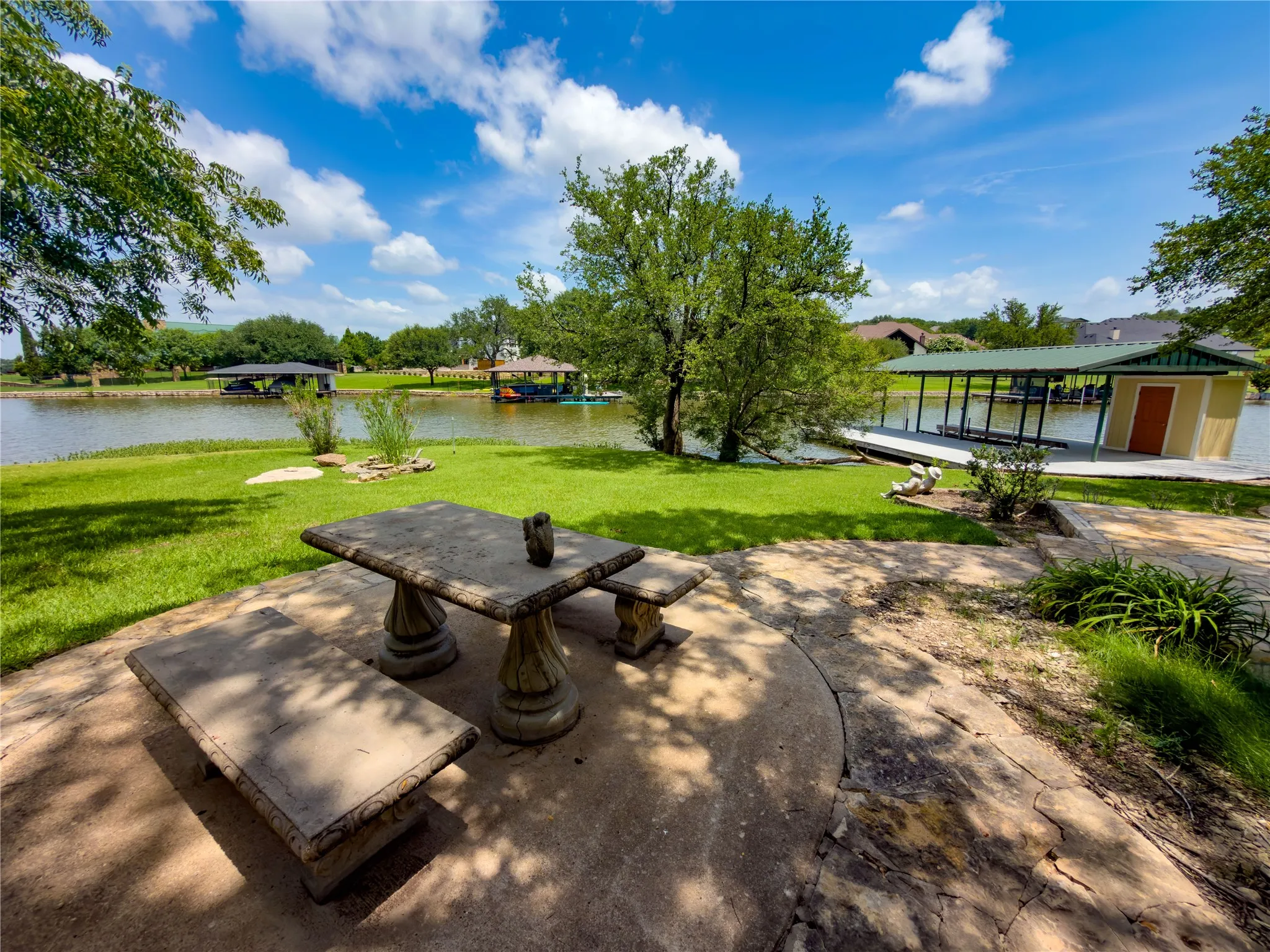 Patio and firepit at the water's edge