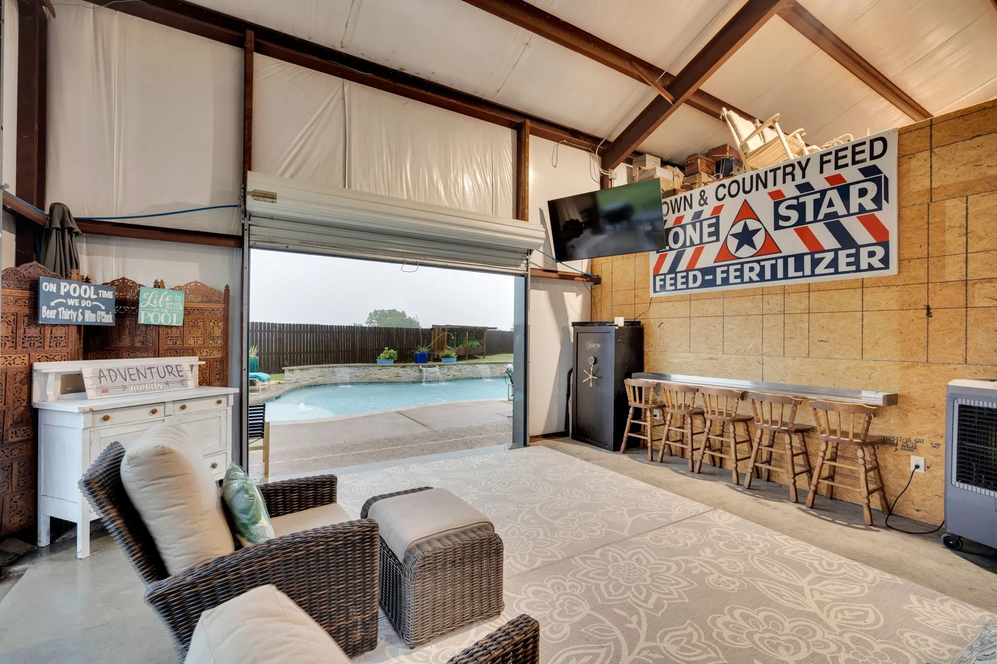 Connected to living space. Rollup door to pool and backyard
