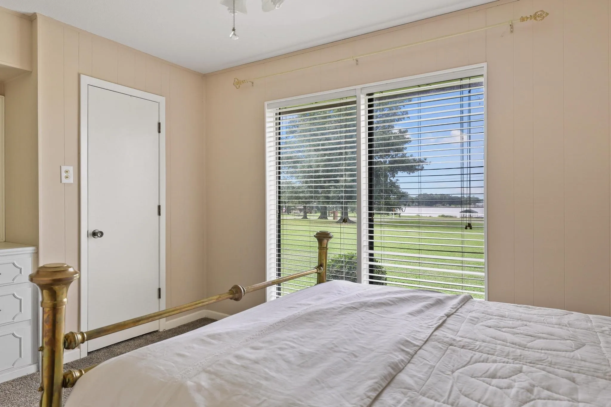Beautiful views of lake from Bedroom.  Walk in closet, ceiling fan