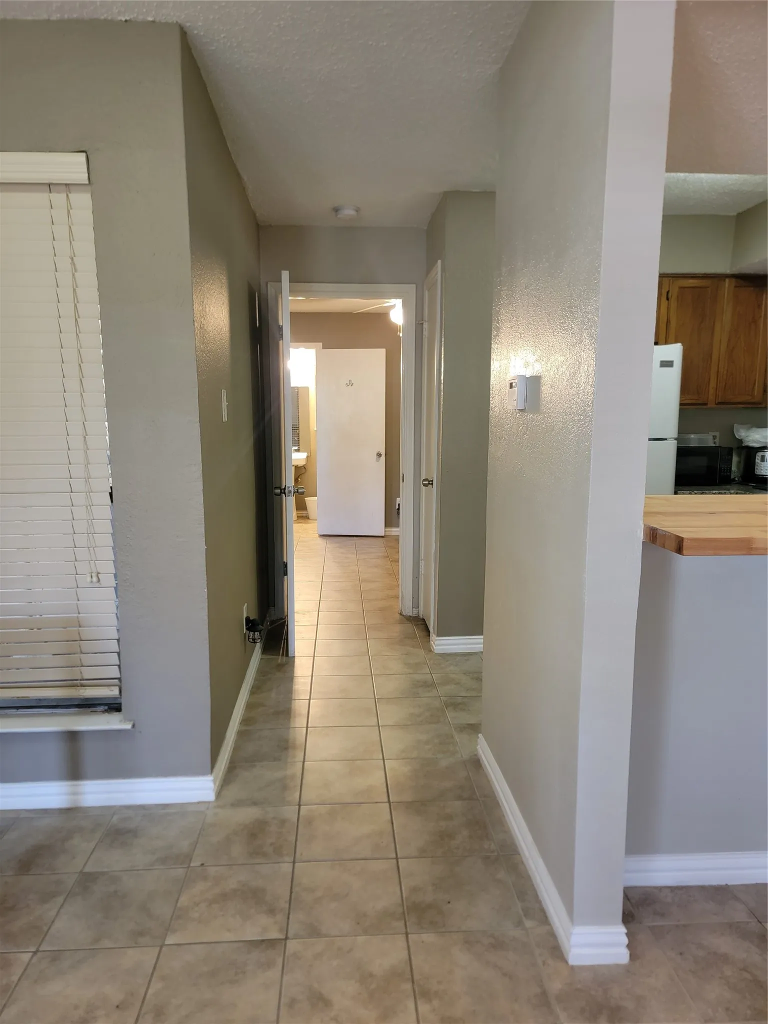 Tile flooring extending through a central hallway