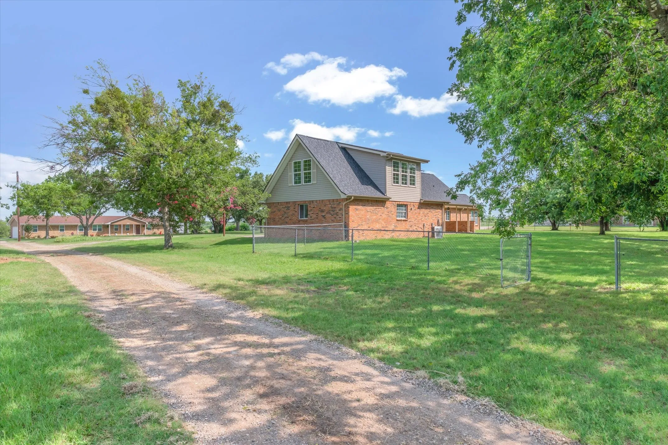 Rear view of home and large back yard, view from workshop.