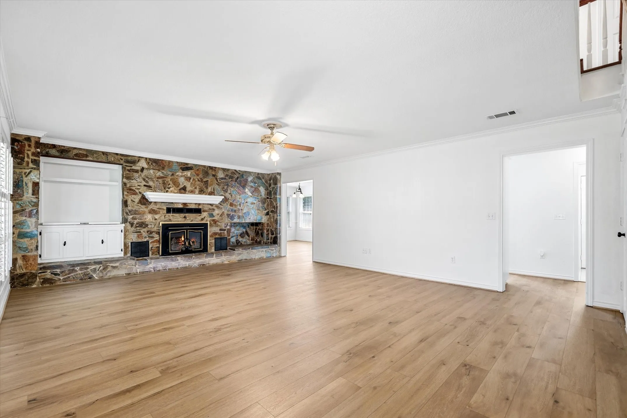 Large family room with wood burning fireplace.