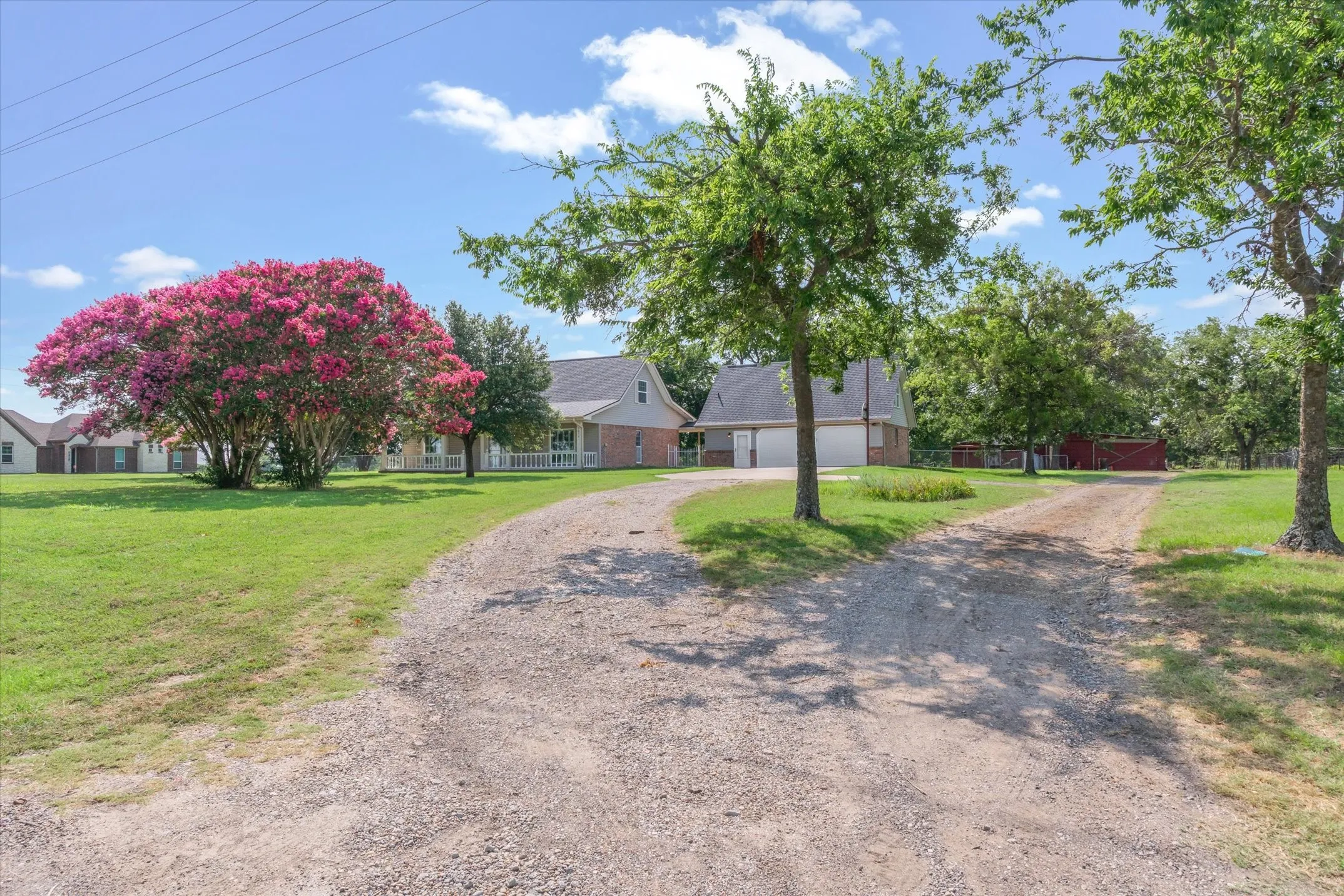 Separate driveway to workshop in back of property.
