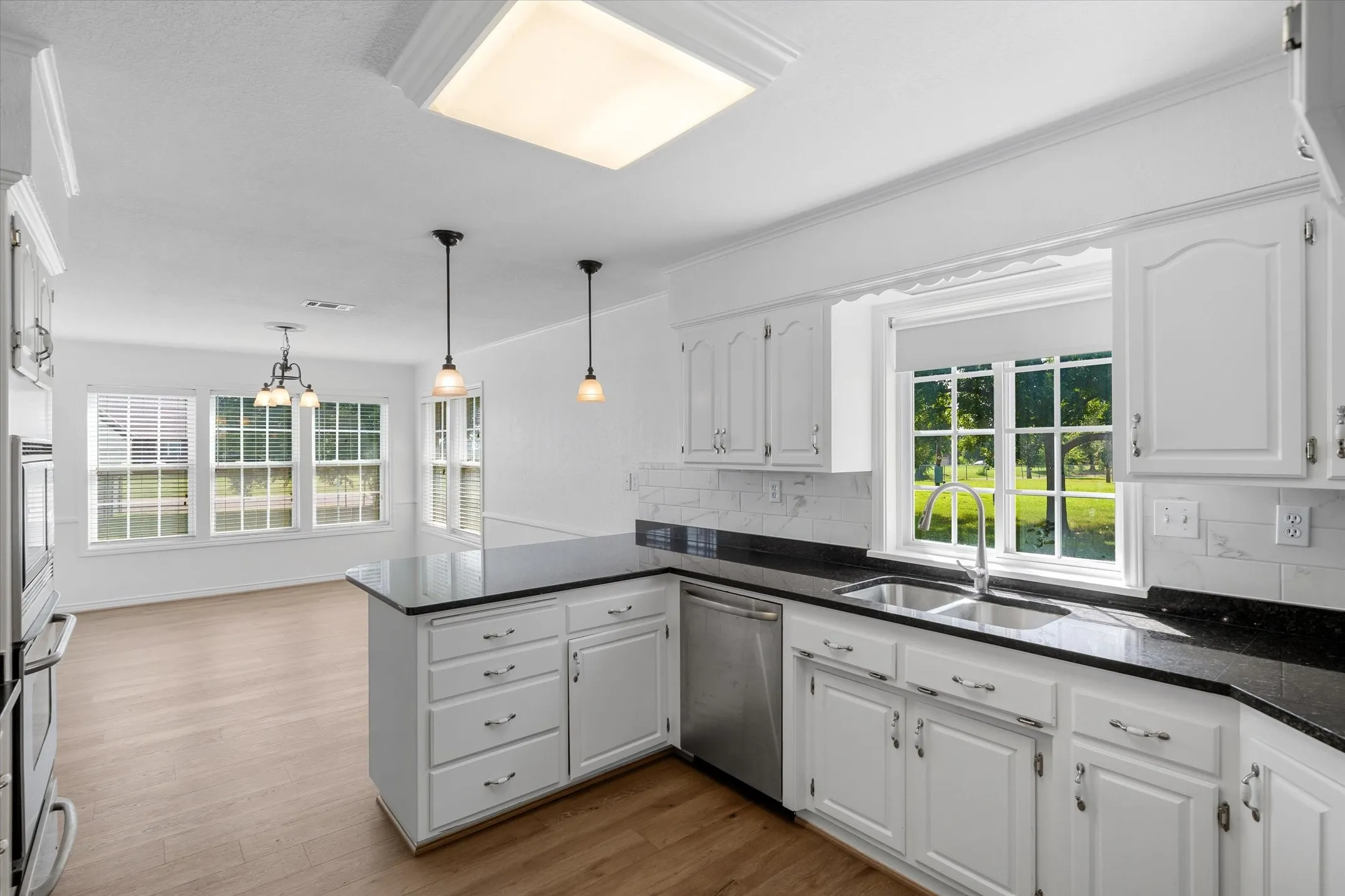 Plenty of light with loads of windows make this a bright work space for preparing meals.