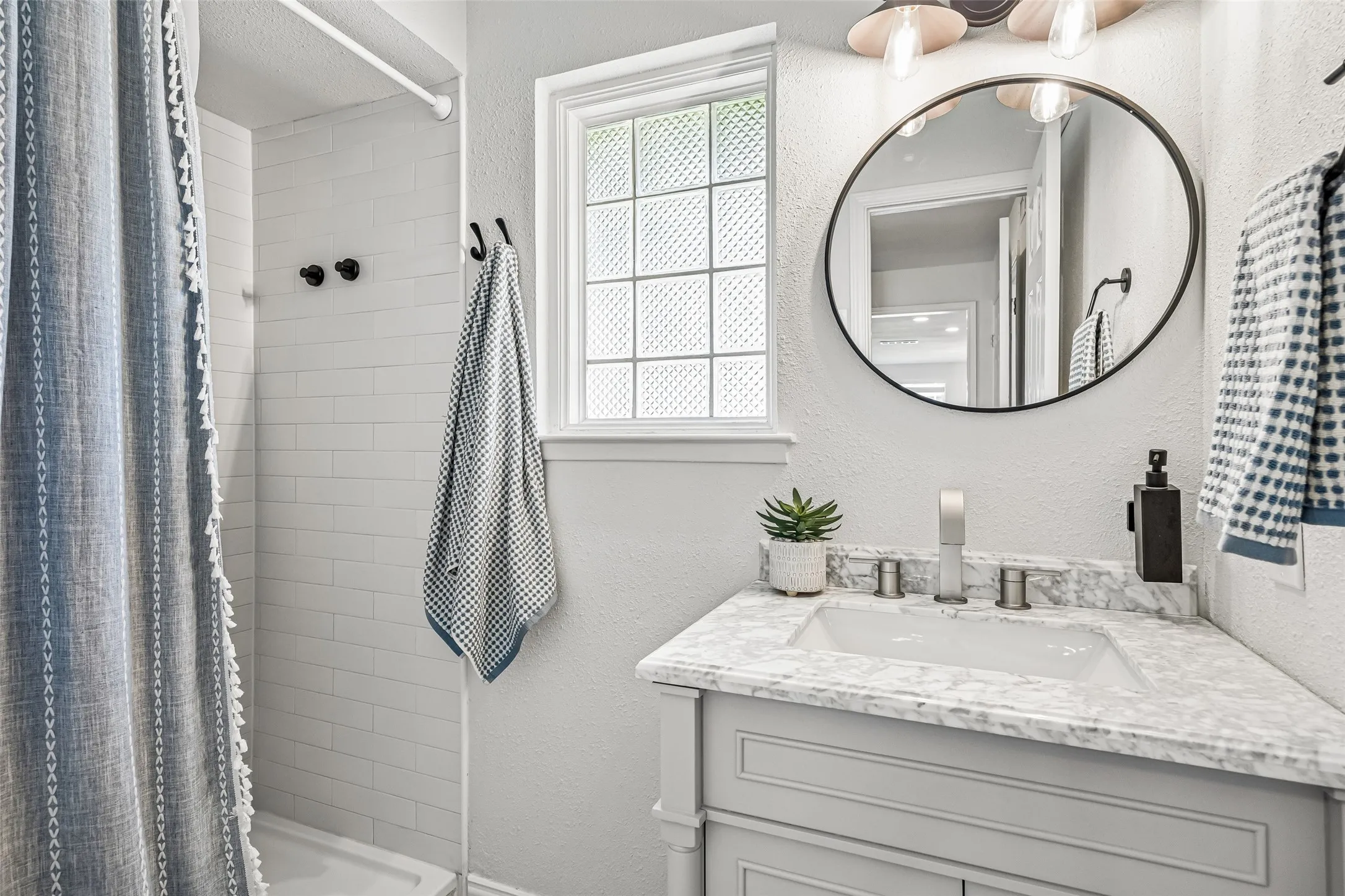A full-sized bath services guests and could double as a pool bath.