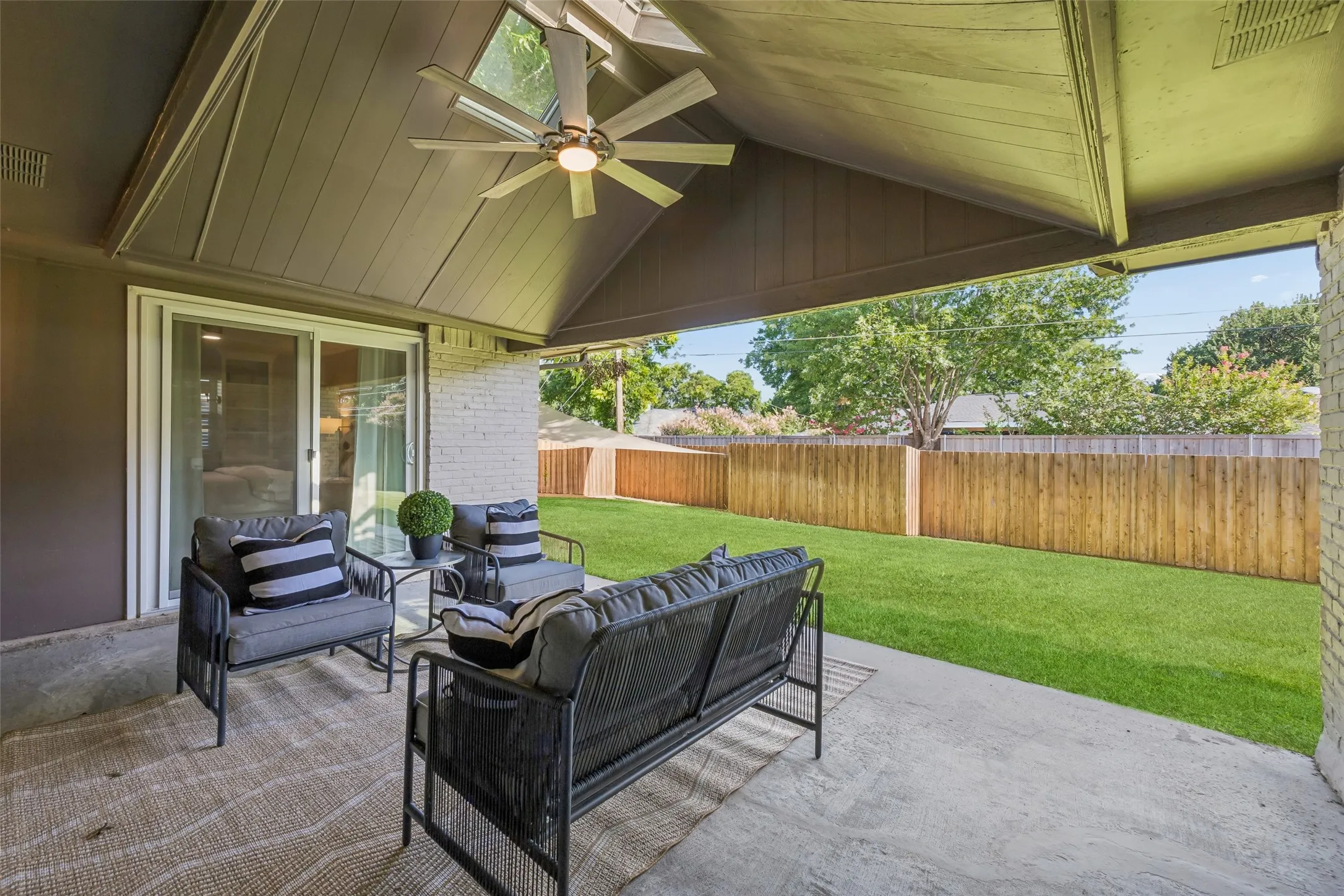 The large covered patio is home base for the backyard canvas beyond. Check out the skylights in the vaulted ceiling. What a plus! It would be so easy to add remote control screens, or a fireplace, or an outdoor kitchen.