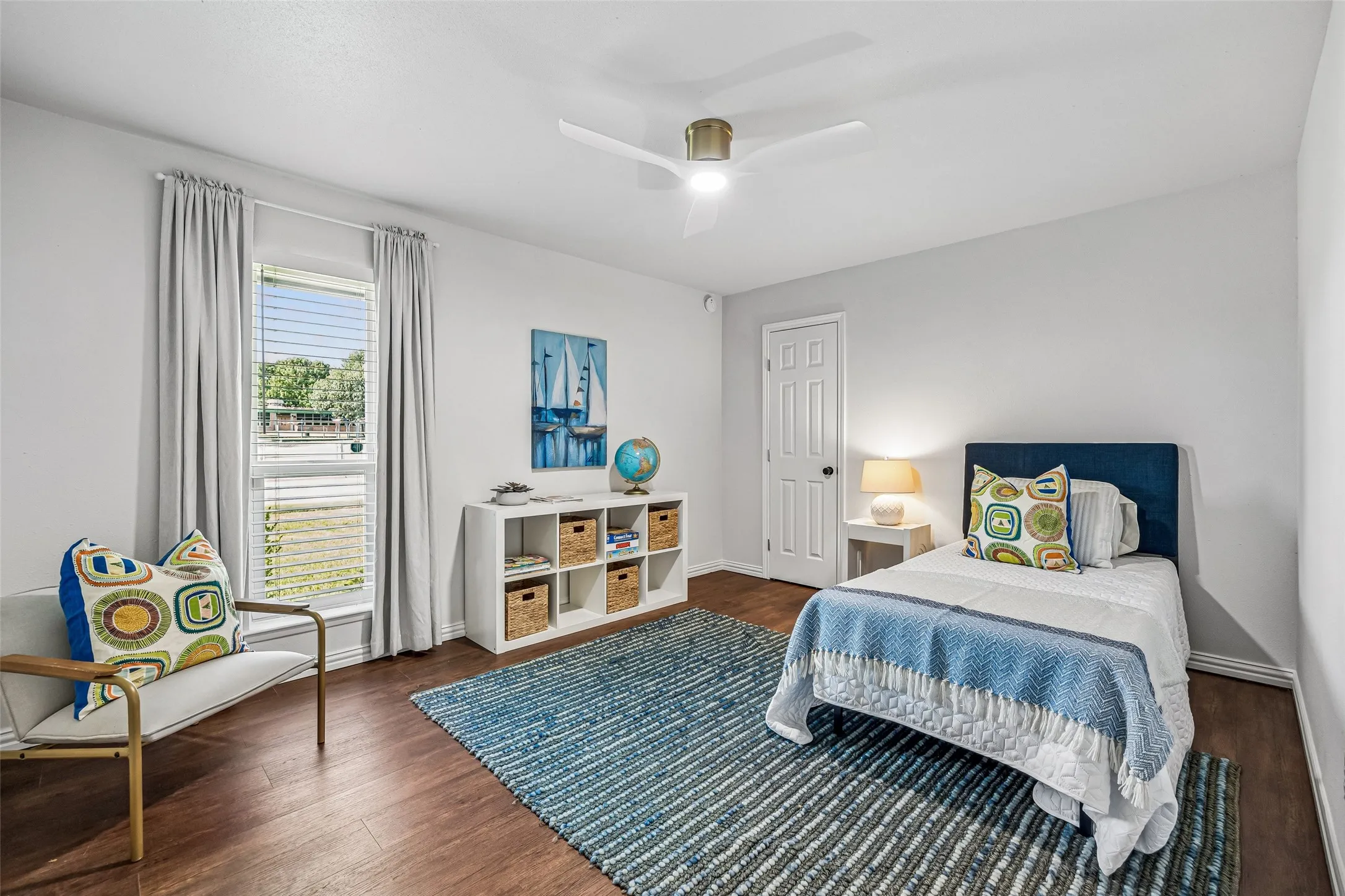 Each generously sized secondary bedroom features outdoor views, wood floors, and ample closet space.