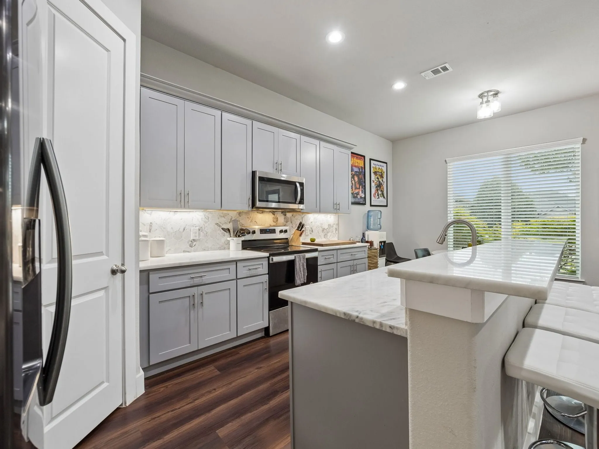 Great work island is a center point of open floor plan