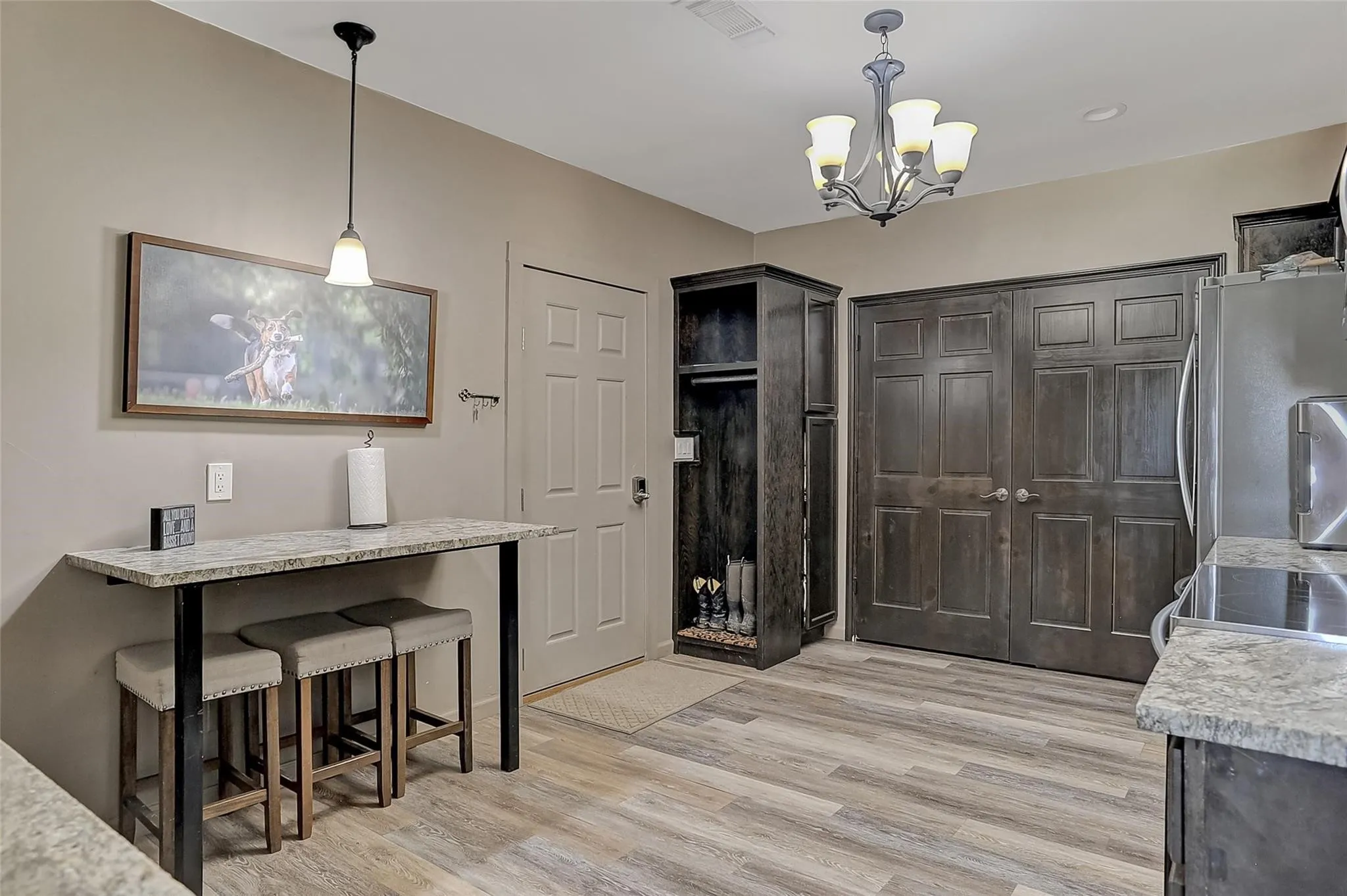Laundry closet in the single family home's kitchen area is full-size.