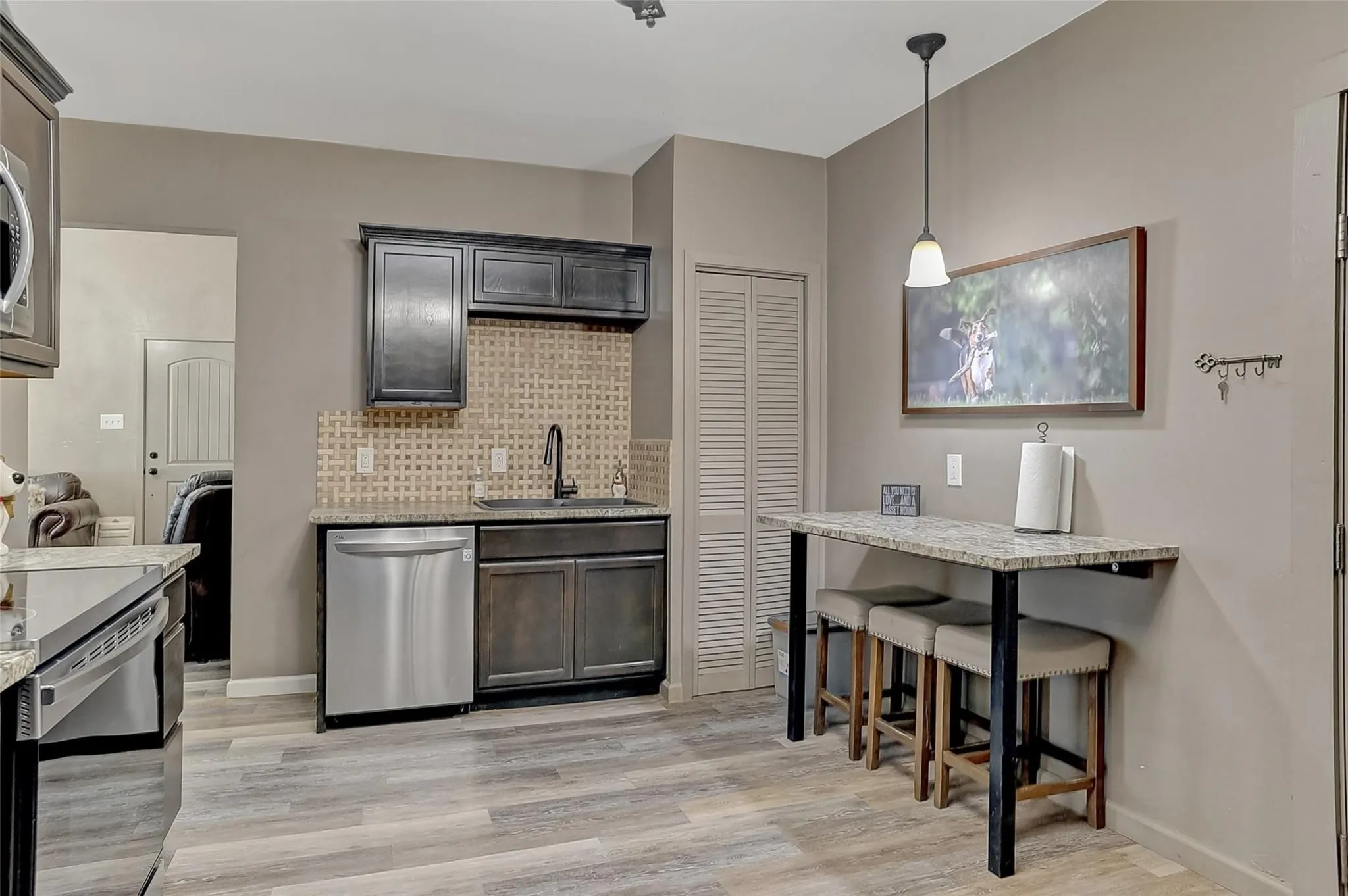 Spacious, efficient kitchen with a small eat-at bar in the single family home.