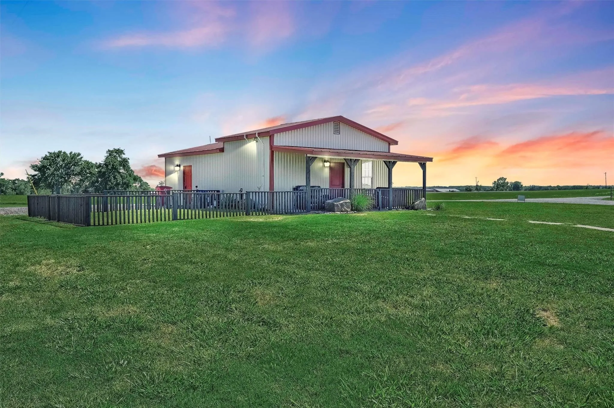 900 SF single family home has fenced yard and a covered front porch.
