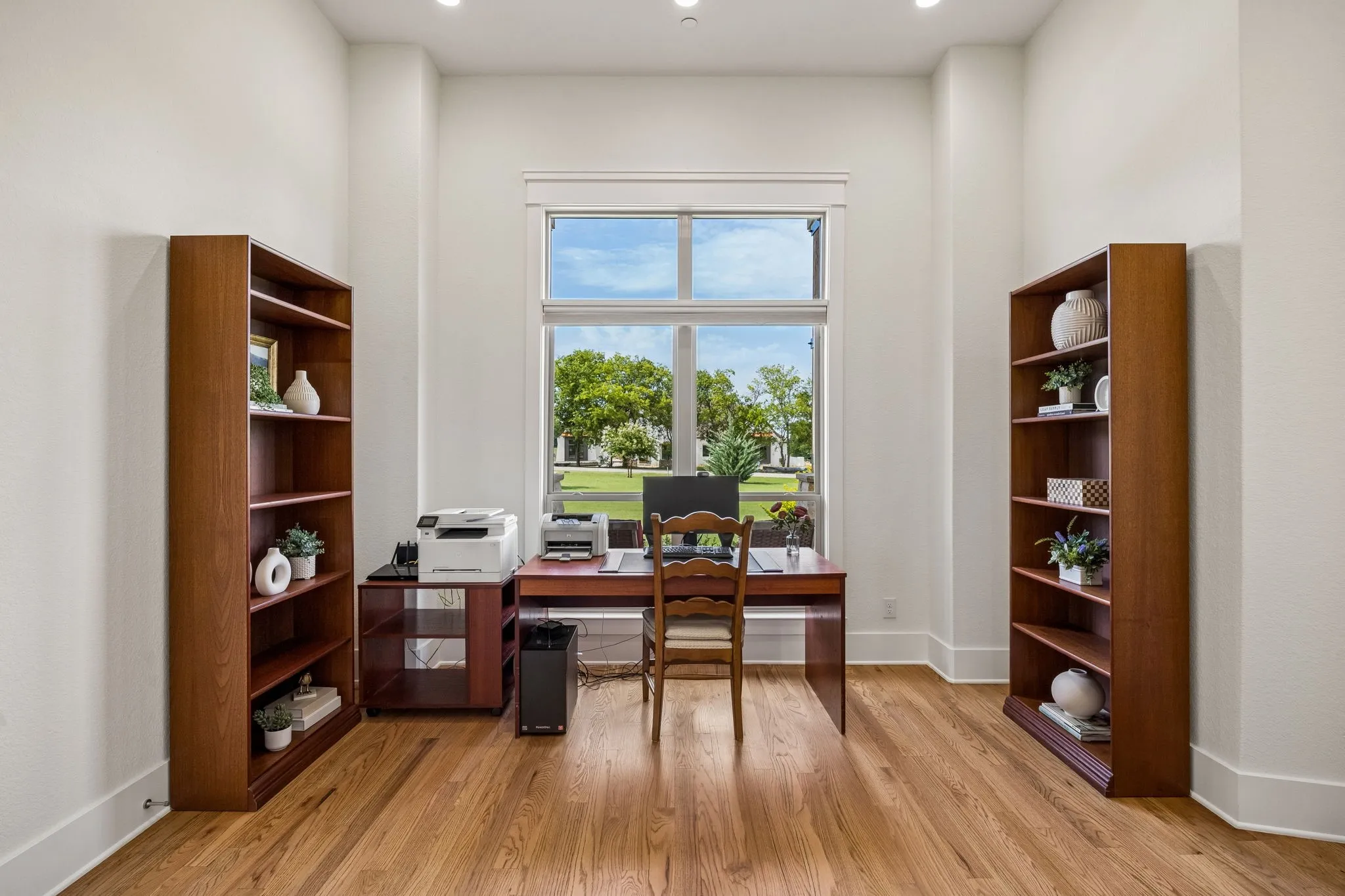 French doors lead to your private office with peaceful views of the professionally landscaped grounds showcasing a variety of beauty year-round.
