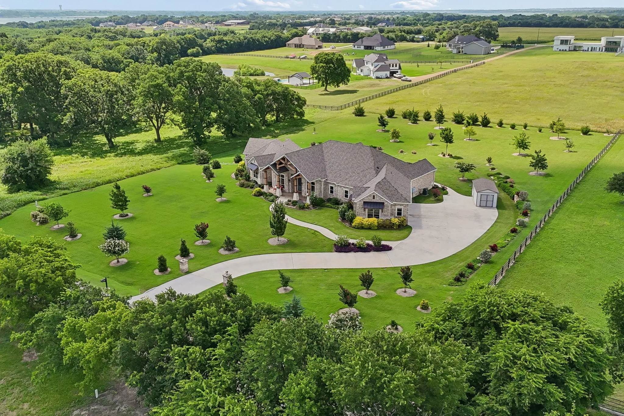 This remarkable estate is set among two acres of breathtaking year-round color, texture, and seasonal beauty.