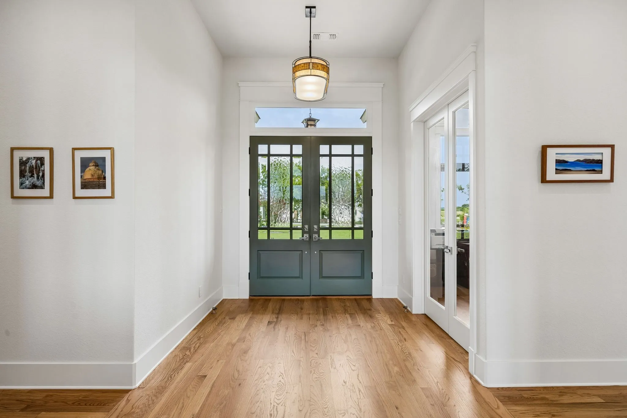 The inviting foyer displays double doors to your private office office and flows seamlessly to the vaulted family room with stunning views of the professionally manicured grounds.