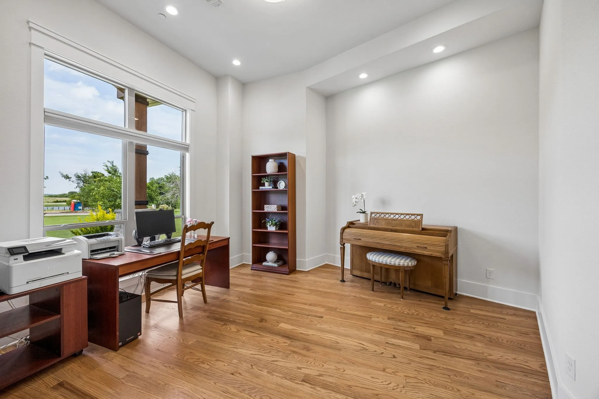 French doors lead to your private office with peaceful views of the professionally landscaped grounds showcasing a variety of beauty year-round.