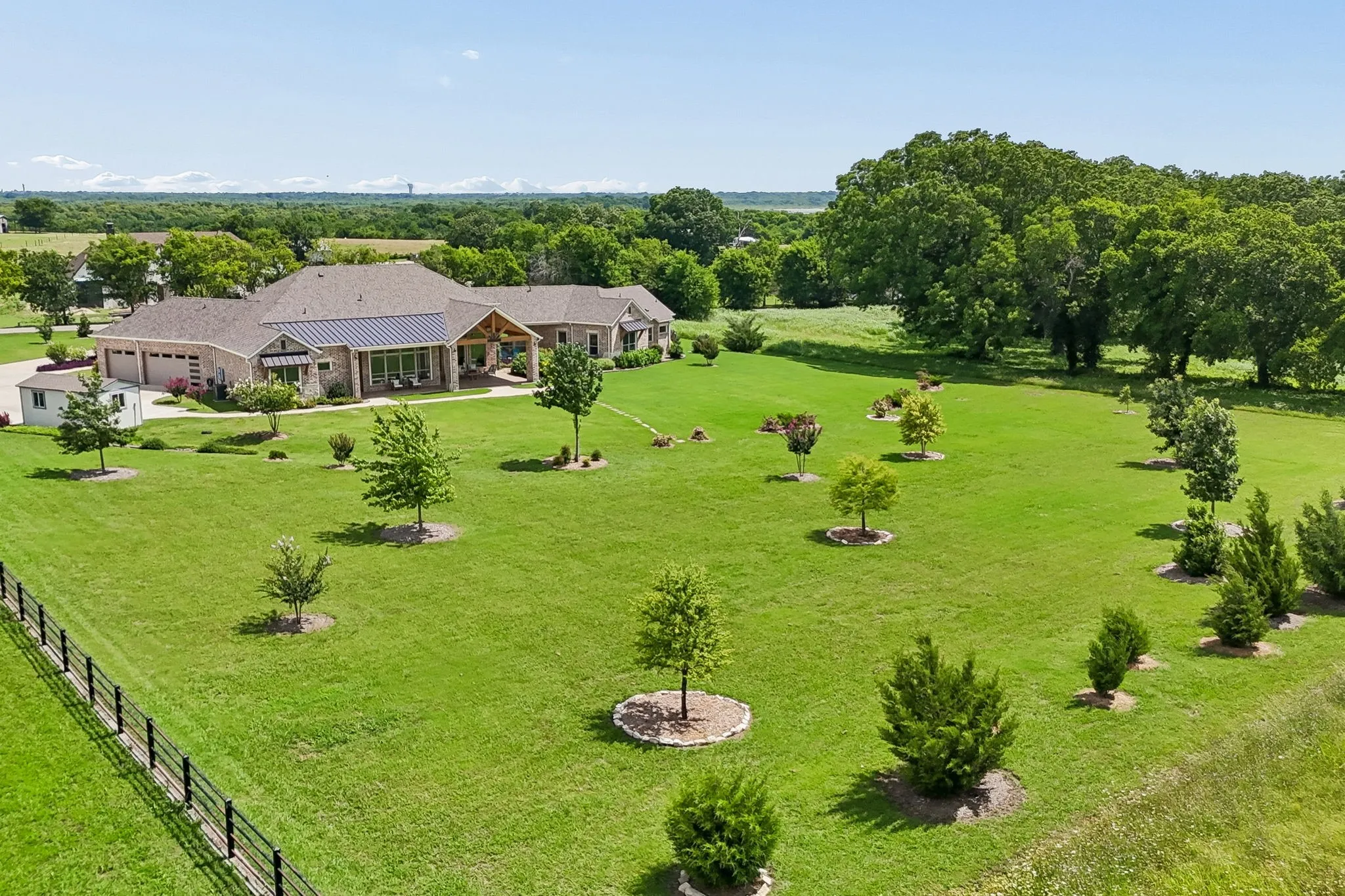 Expansive green lawn with mature trees, this remarkable estate is set among two acres of breathtaking year-round color, texture, and seasonal beauty.