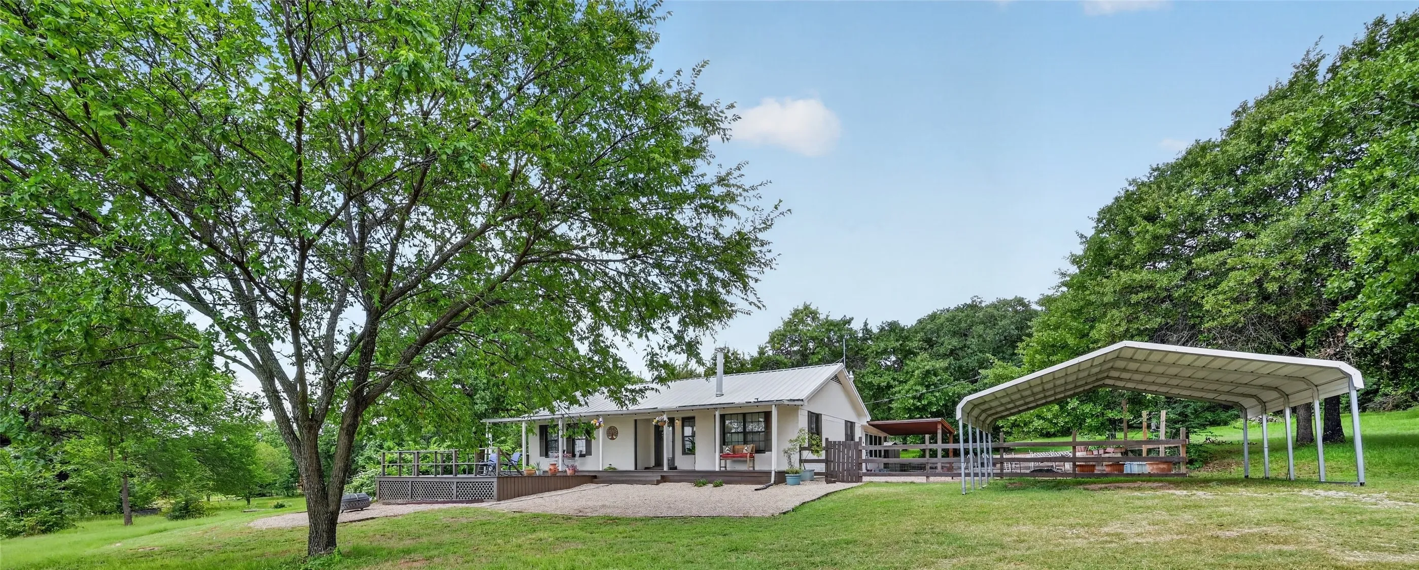 Front of house with covered carport