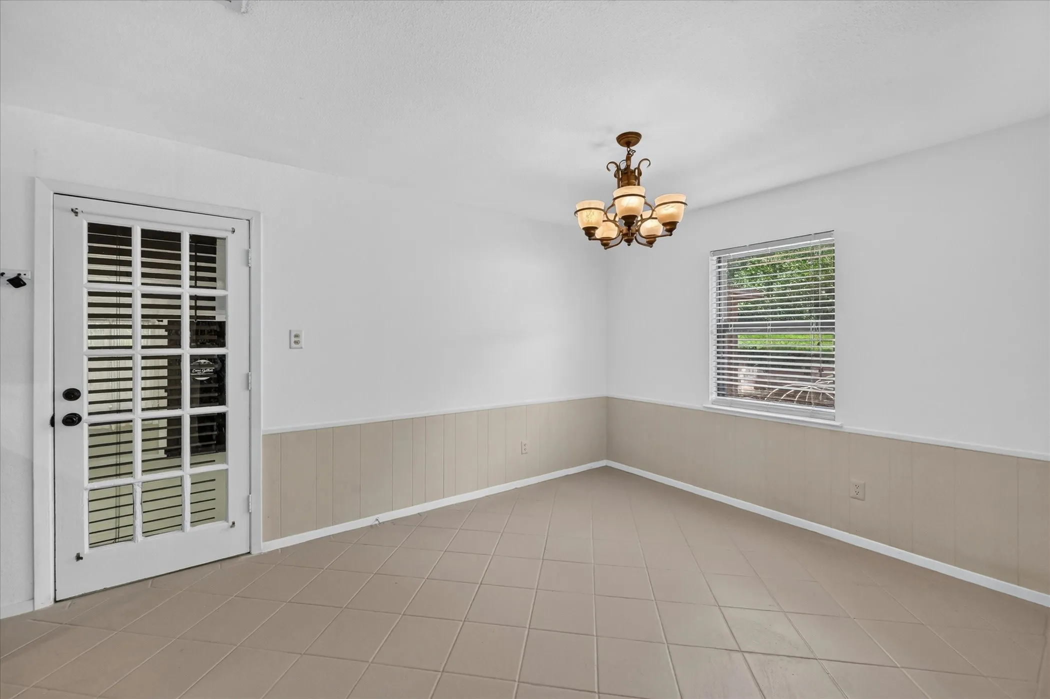 Spacious dining area featuring ceramic tile flooring