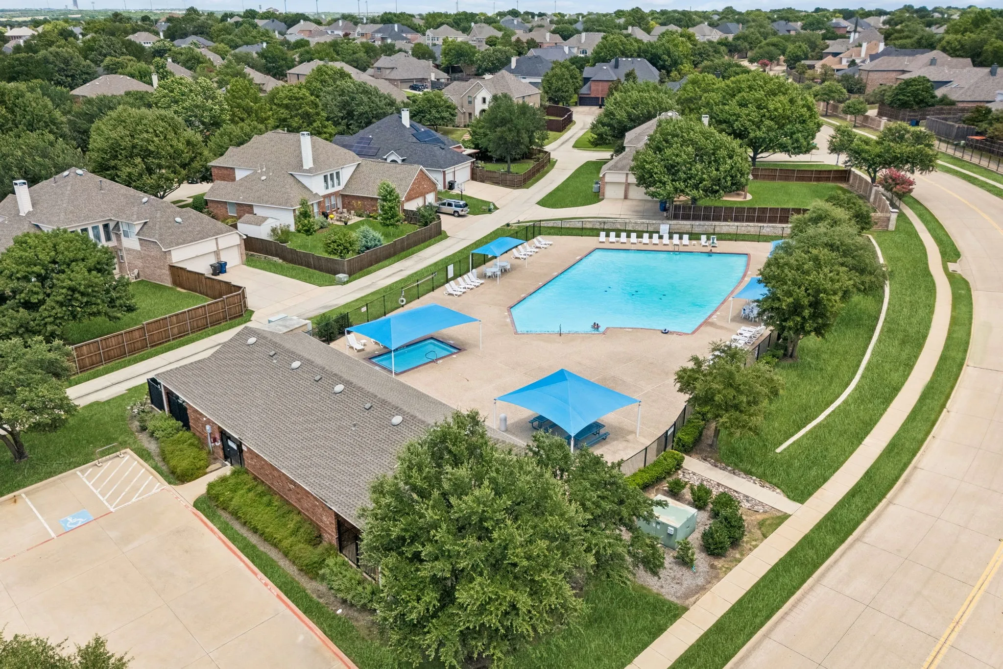 Community pool and club house as part of this home's HOA amenities