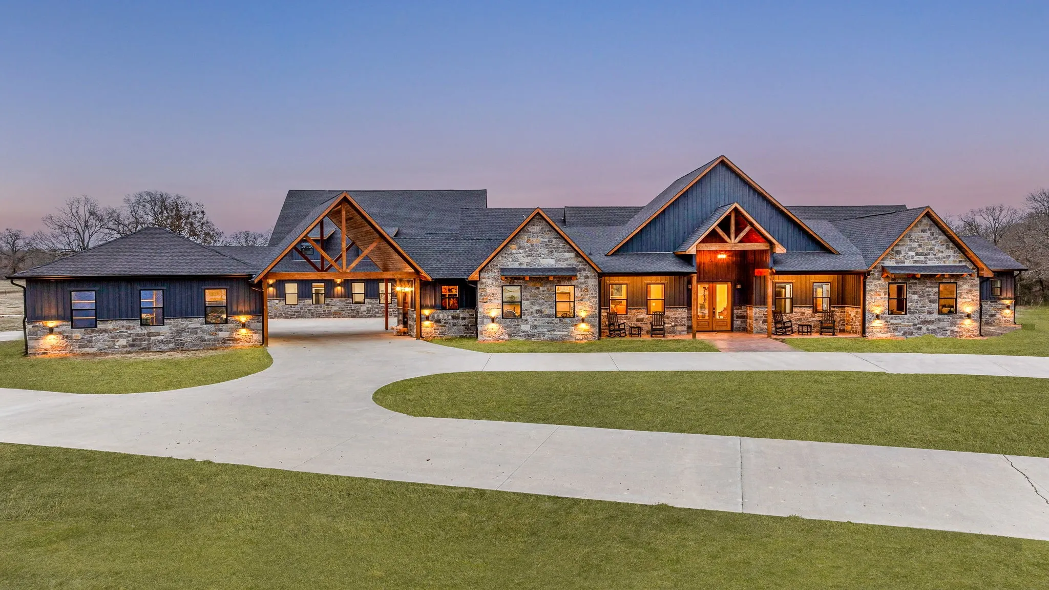 Craftsman-style home with stone siding, a front lawn, and covered porch