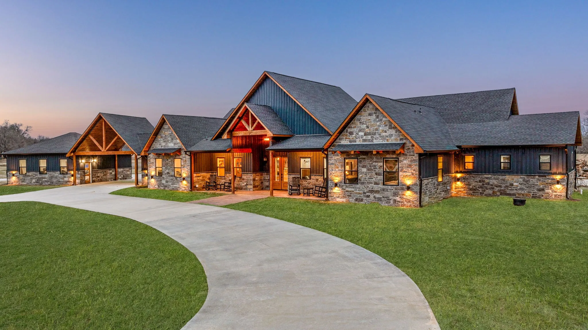 Craftsman inspired home with stone siding, a front yard, and a porch