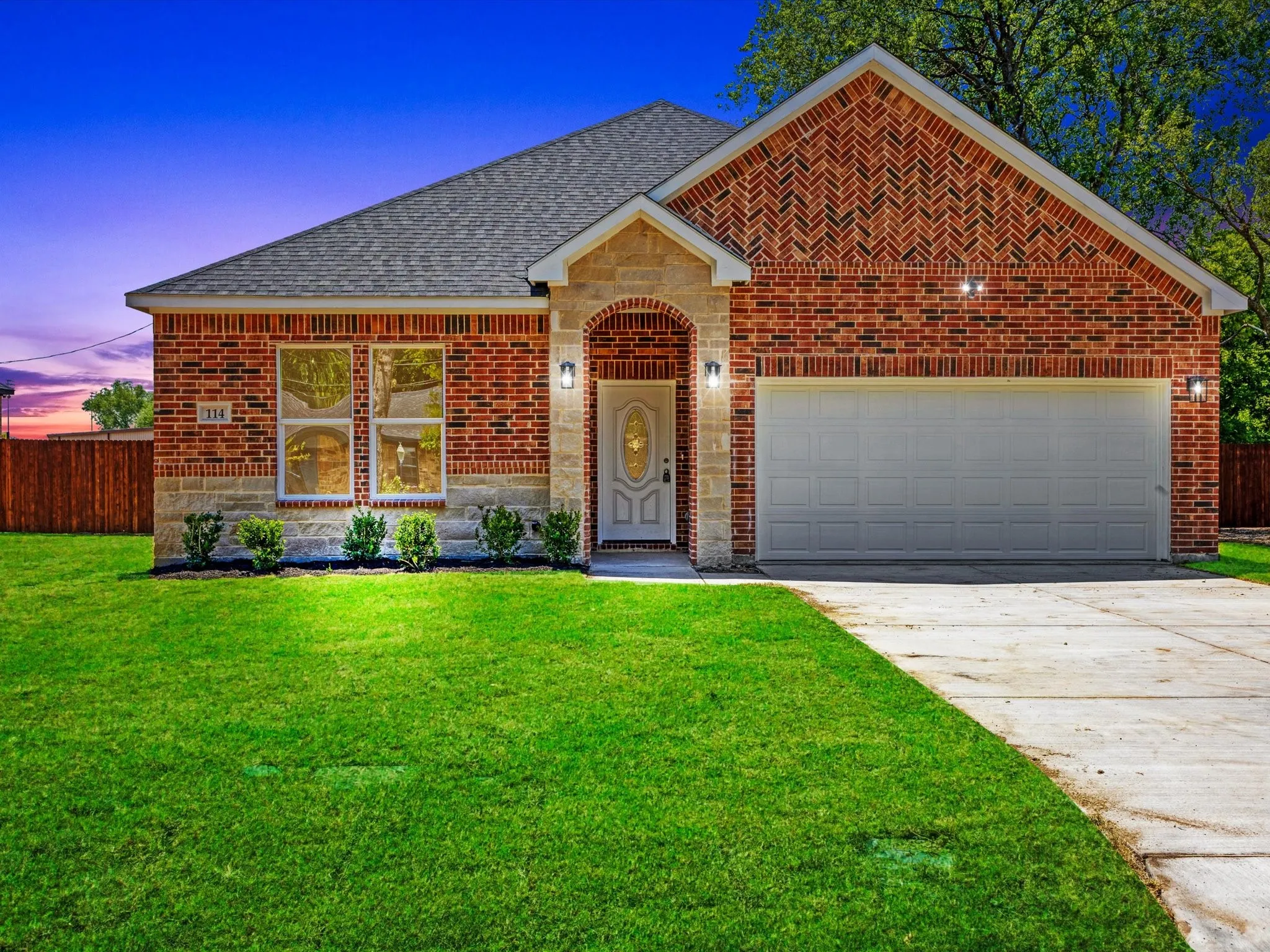 Brick and stone exterior with architectural shingle roof