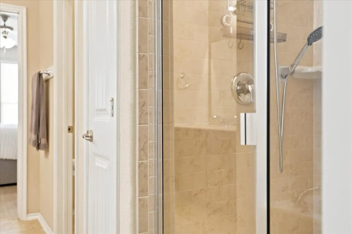 Separate walk in shower in primary bath.